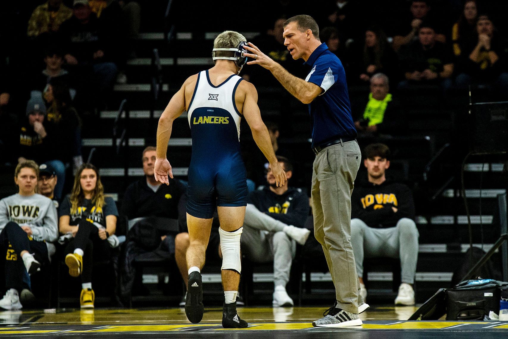 California Baptist head coach Derek Moore, right, talks with 125 pound wrestler Elijah Griffin after a match during a NCAA wrestling dual against Iowa, Sunday, Nov. 13, 2022, at Carver-Hawkeye Arena in Iowa City, Iowa.

221113 Cal Baptist Iowa Wr 041 Jpg
