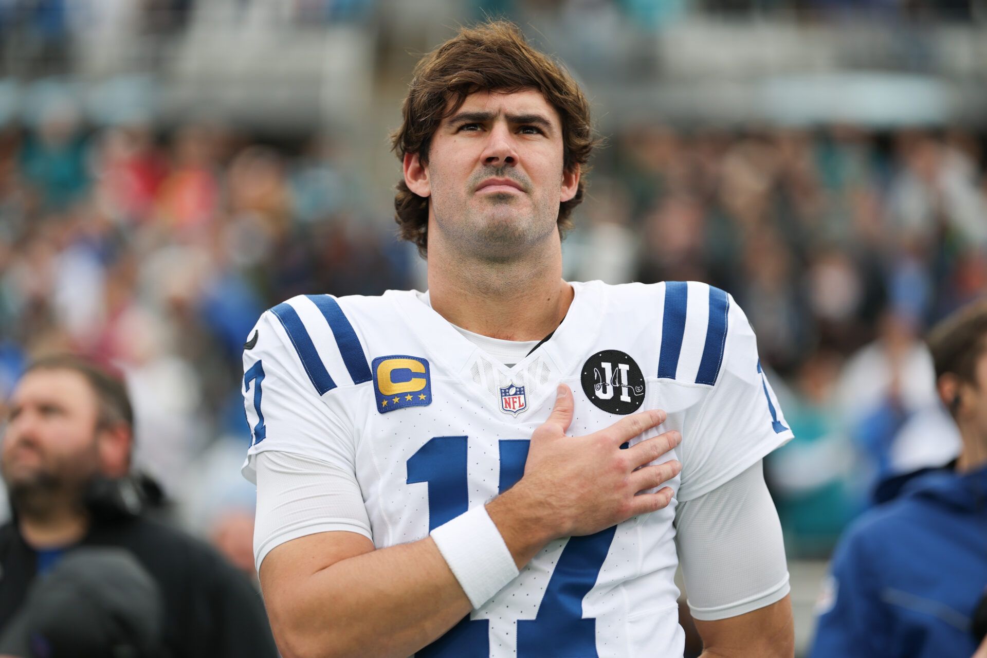 Indianapolis Colts quarterback Daniel Jones (17) stands on the field during the National Anthem before a game against the Jacksonville Jaguars at EverBank Stadium.