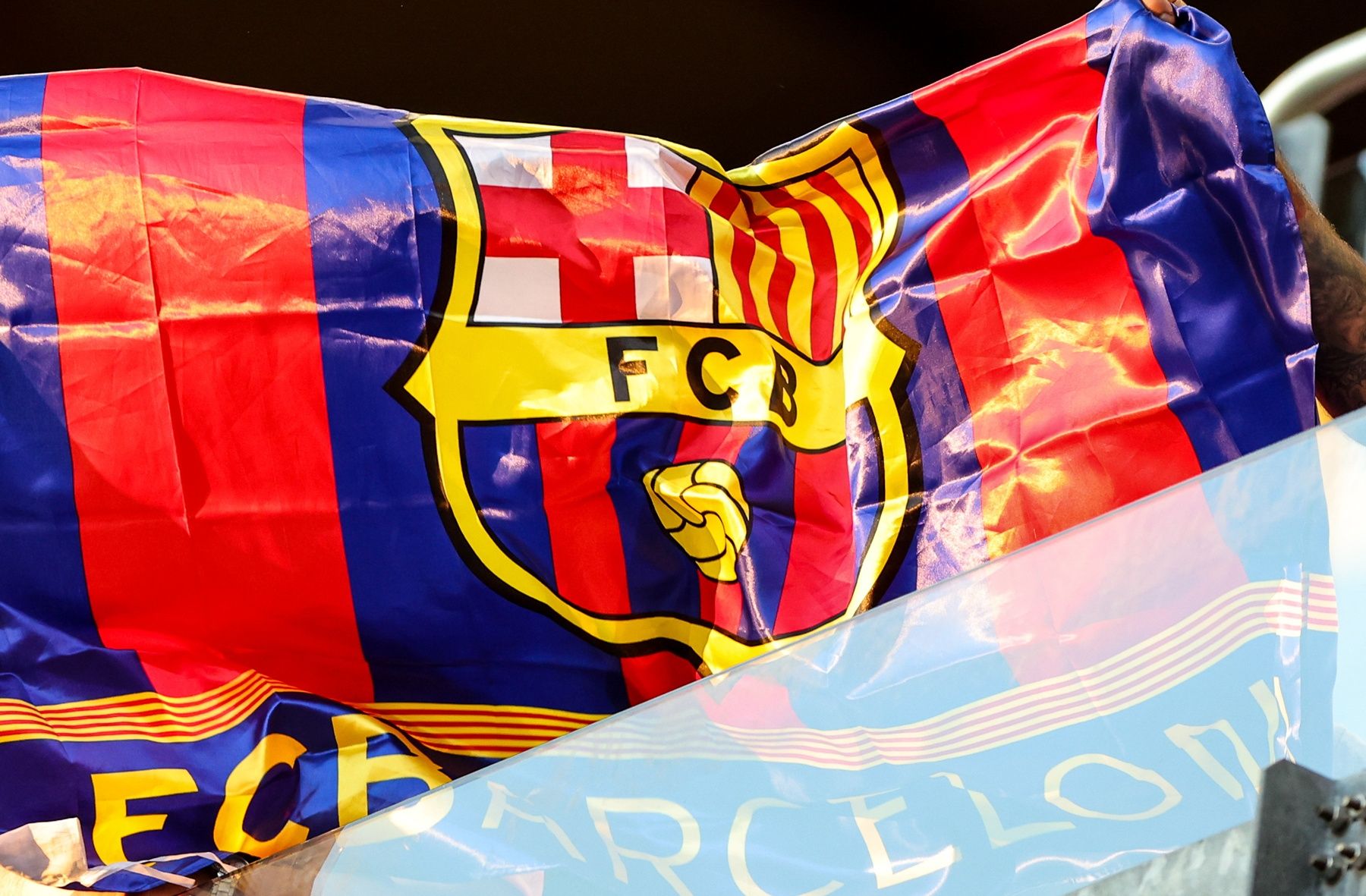 FC Barcelona fans wave a flag during the first half between the New York Red Bulls and FC Barcelona at Red Bull Arena.
