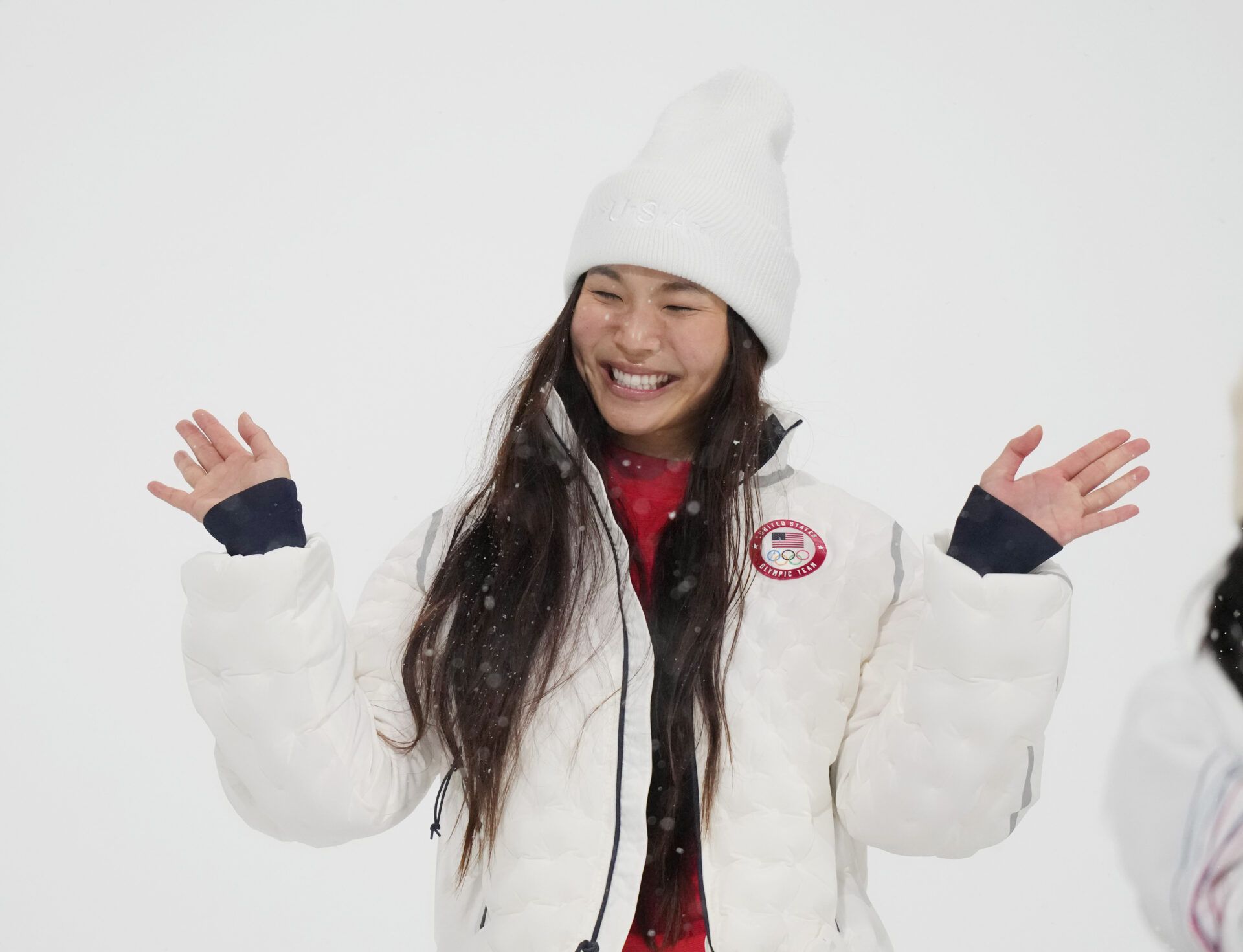 Chloe Kim of the United States celebrates on the podium after winning the silver medal in the women's halfpipe final during the Milano Cortina 2026 Olympic Winter Games at Livigno Snow Park.