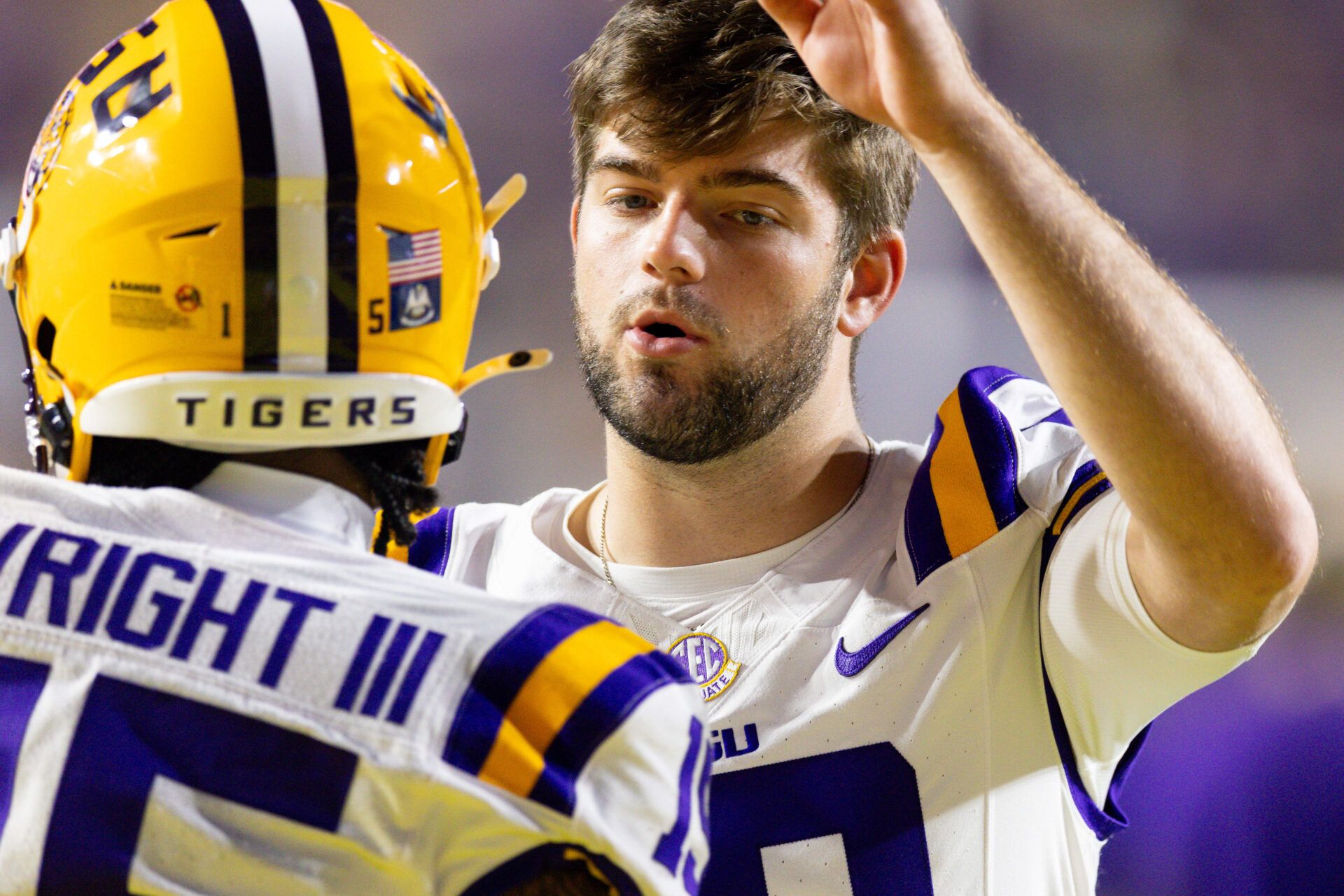 LSU Tigers quarterback Garrett Nussmeier (18) slaps hands with wide receiver Phillip Wright III (15) against the Western Kentucky Hilltoppers  during the pre-game at Tiger Stadium.