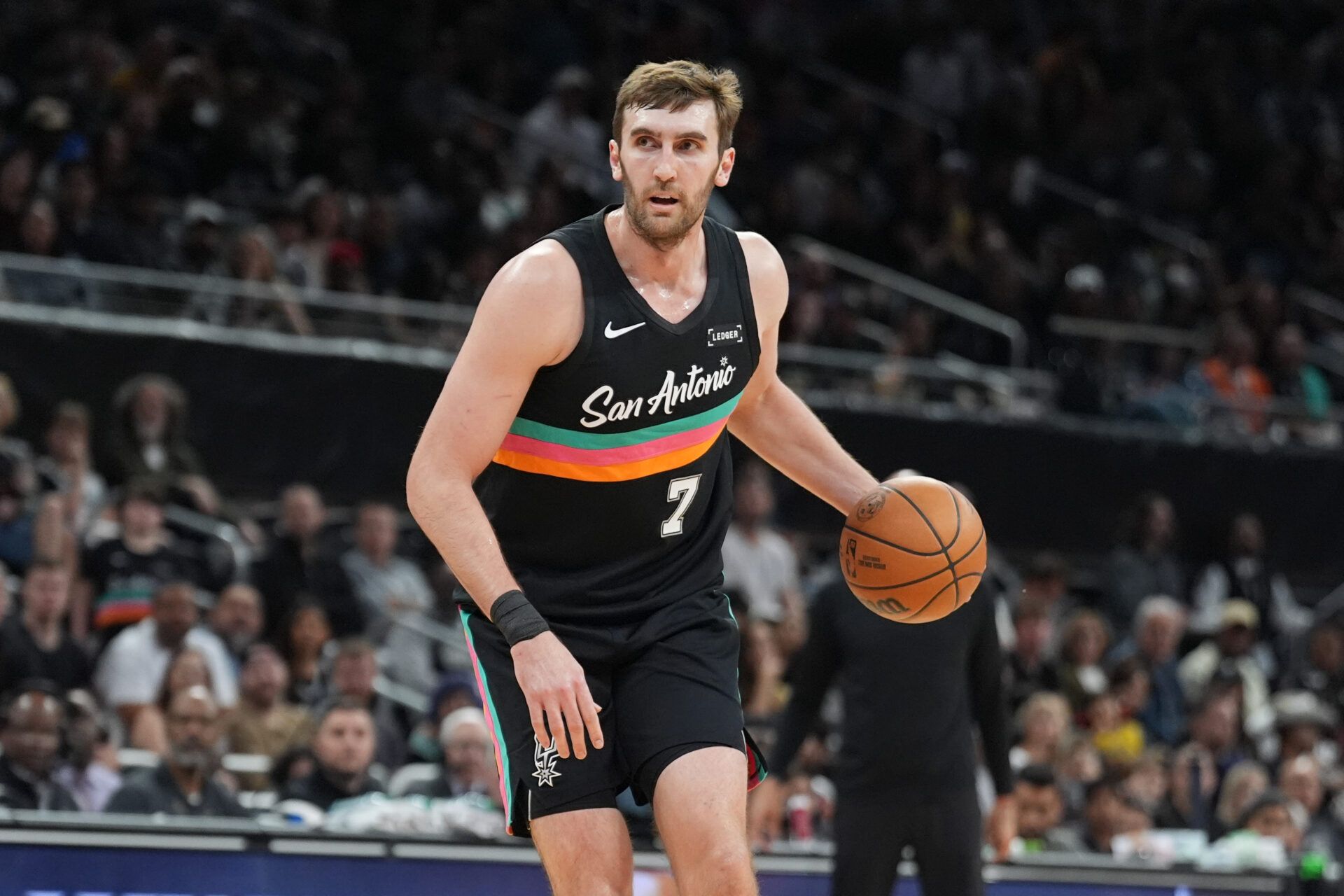 San Antonio Spurs center Luke Kornet (7) dribbles in the second half against the Sacramento Kings at Moody Center.