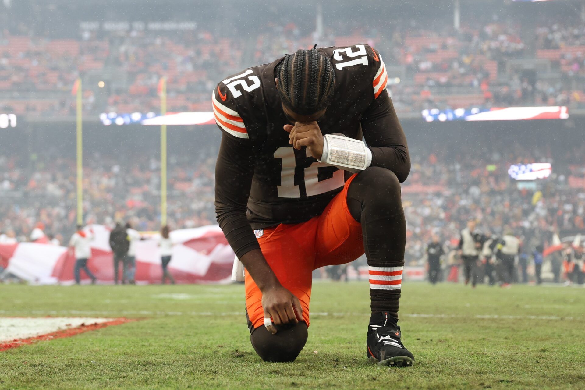 Cleveland Browns quarterback Shedeur Sanders (12) kneels before the game against the Pittsburgh Steelers at Huntington Bank Field.