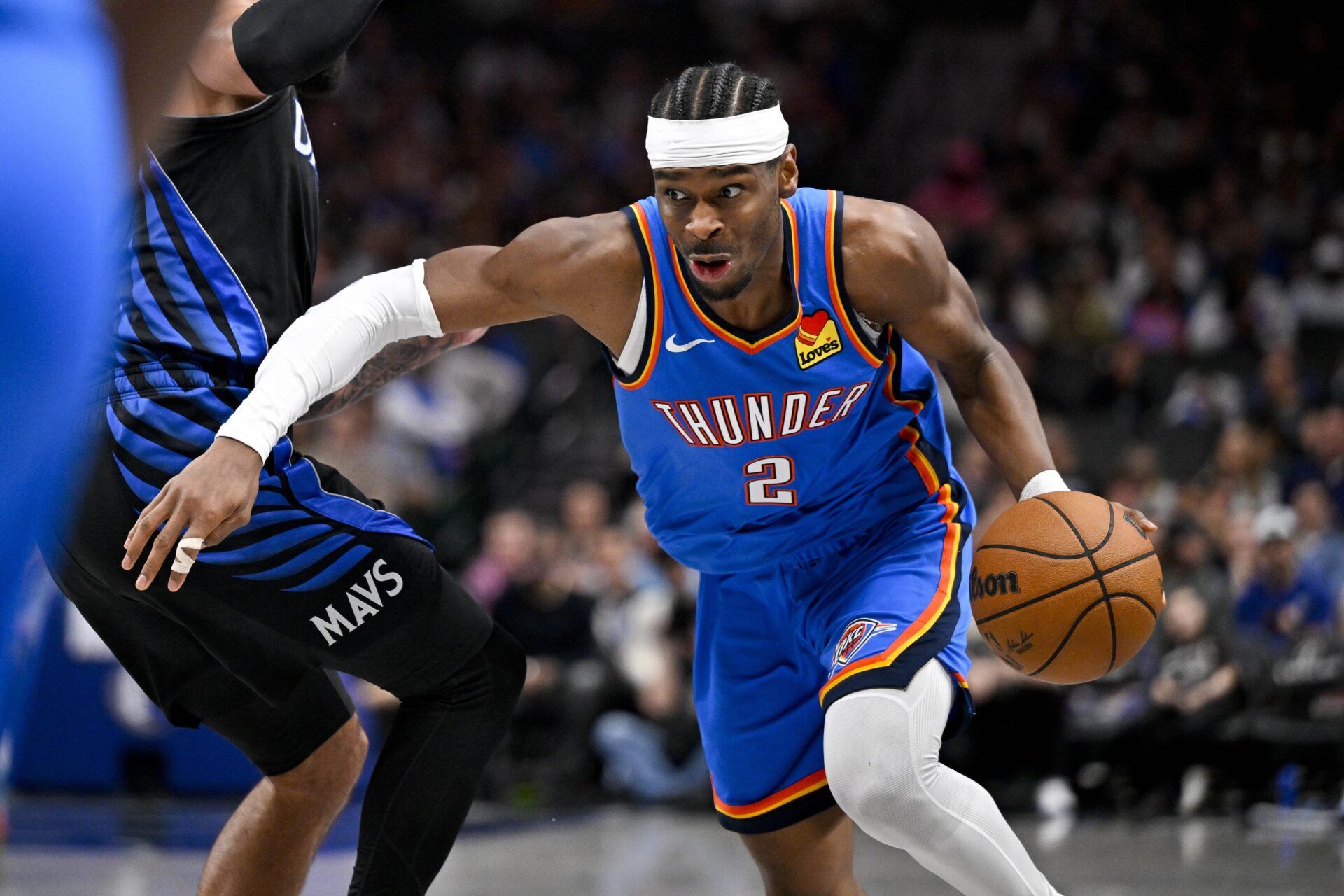Oklahoma City Thunder guard Shai Gilgeous-Alexander (2) controls the ball during the game between the Mavericks and the Thunder at American Airlines Center.