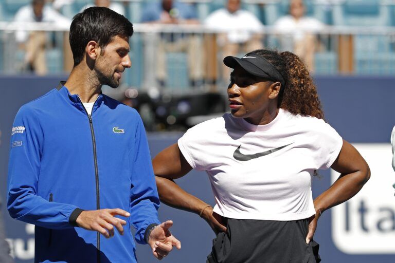 Novak Djokovic of Serbia (L) speaks to Serena Williams of the United States (R) during a ribbon cutting ceremony on new stadium court at Hard Rock Stadium prior to play in the first round of the Miami Open at Miami Open Tennis Complex.