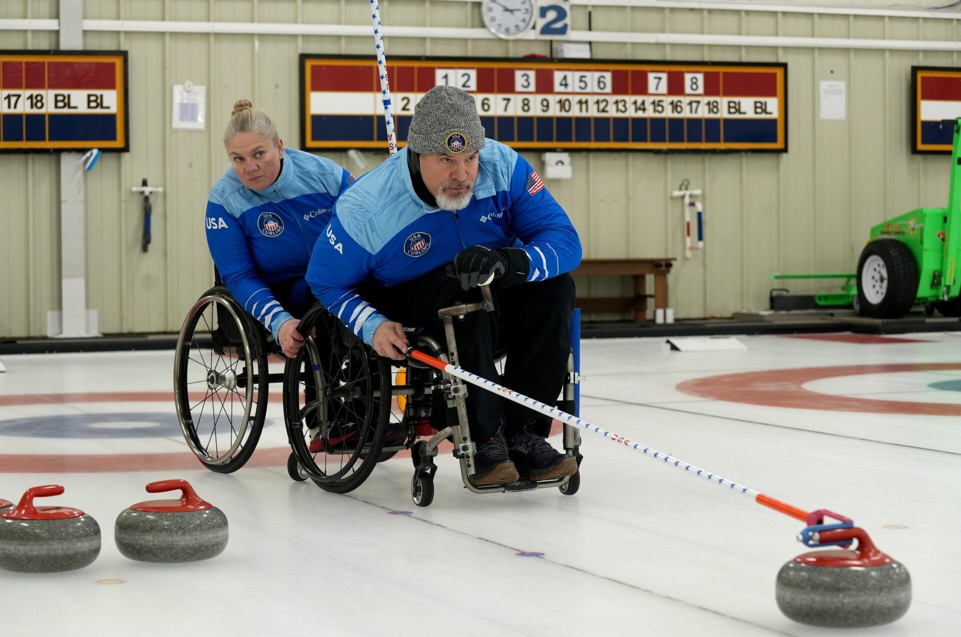 Laura Dwyer stabilizes as teammate Stephen Emt prepares to slide is stone across the ice. Both Paralympians are from Wisconsin. Emt started curling at the Cape Cod Curling Club in Falmouth and has gone on to compete in national competitions. The 2026 winter games will be his third Paralympics.
Dwyer was the first female alternate for the 2022 Paralympic Winter Games in Beijing and has represented the United States in the world championships. Last year, Dwyer and Emt represented the United States at the world championship in the wheelchair mixed doubles division. 
The Cape Cod Curling Club in Falmouth hosted the Paralympic wheelchair curling Team USA Friday and Saturday. The team, including Forestdale resident Sean O'Neill, is preparing to compete in the Paralympic Winter Games Milano Cortina 2026 in March. A training camp that included some games was held at the Falmouth club. The curling club also hosted a fundraiser Saturday to benefit the team. 
Photo taken Jan. 23, 2026