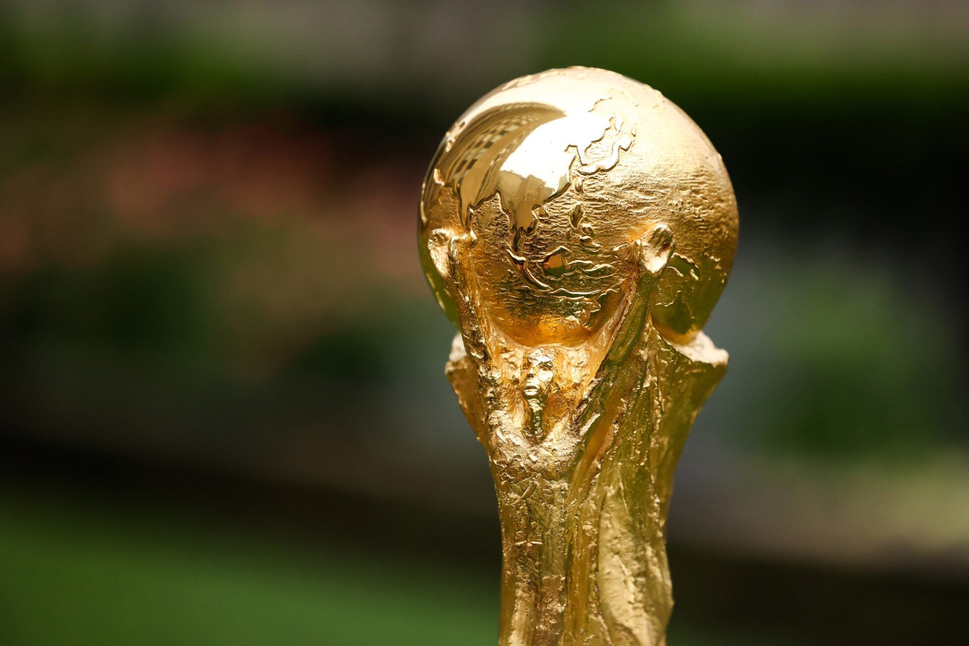 A detail view of The FIFA World Cup Trophy sits on a stand outside of 30 Rockefeller Plaza.