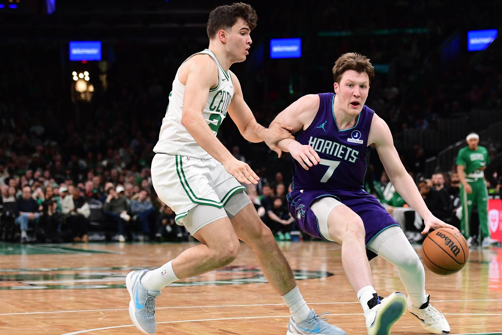 Charlotte Hornets guard Kon Knueppel (7) controls the ball while Boston Celtics guard Hugo Gonzalez (28) defends during the second half at TD Garden.
