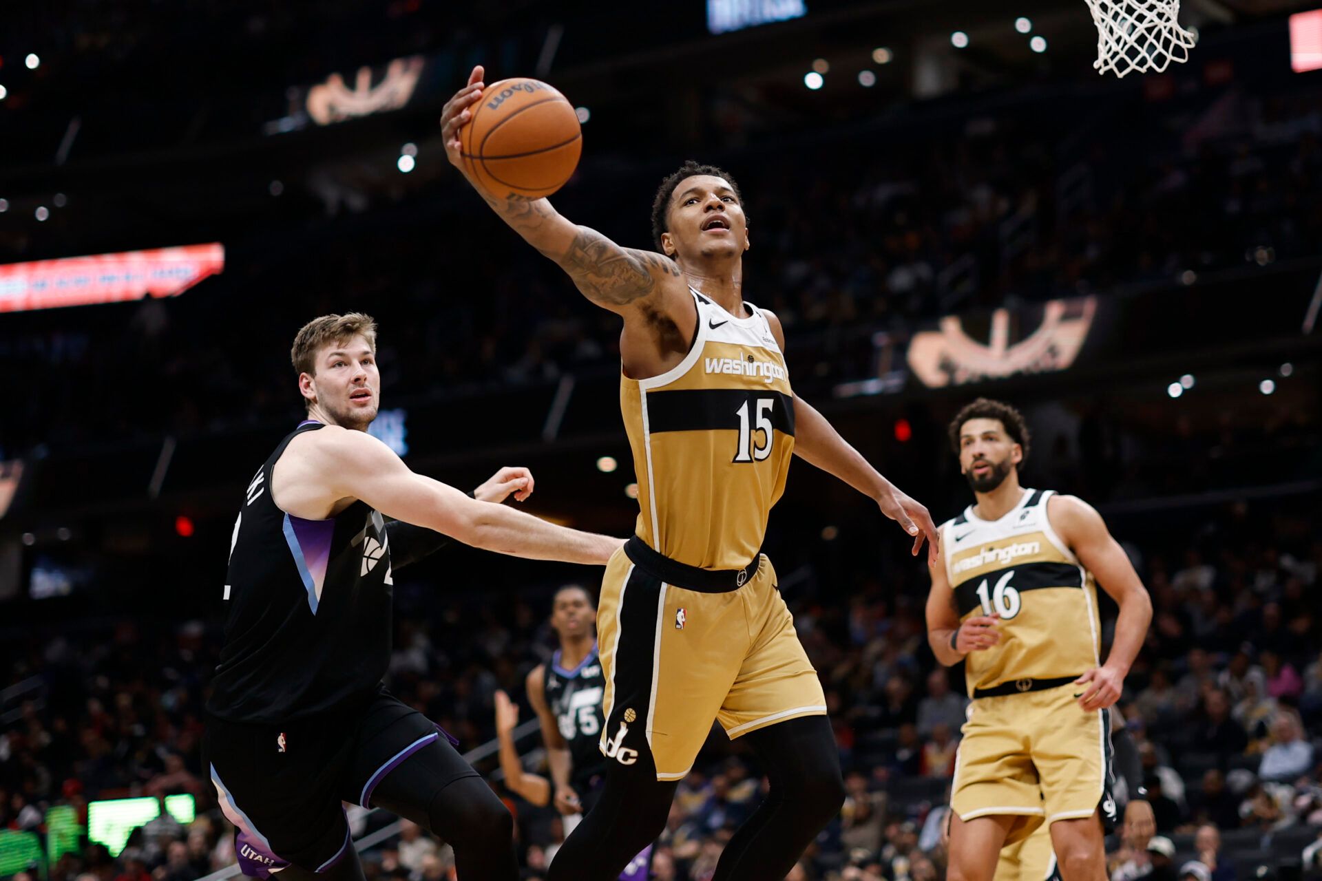 Washington Wizards forward Julian Reese (15) reaches for a rebound in front of Utah Jazz forward Kyle Filipowski (22)in the second half at Capital One Arena.