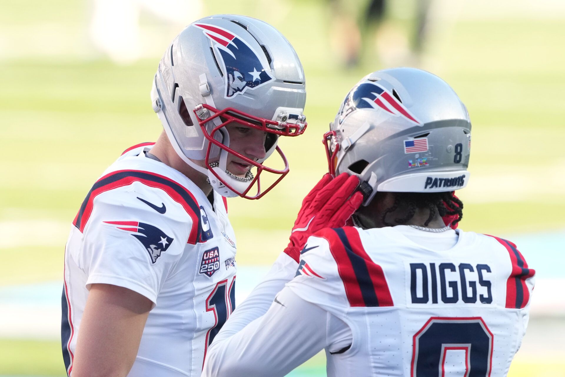 New England Patriots quarterback Drake Maye (left) and wide receiver Stefon Diggs (8) talk before Super Bowl LX against the Seattle Seahawks at Levi's Stadium.