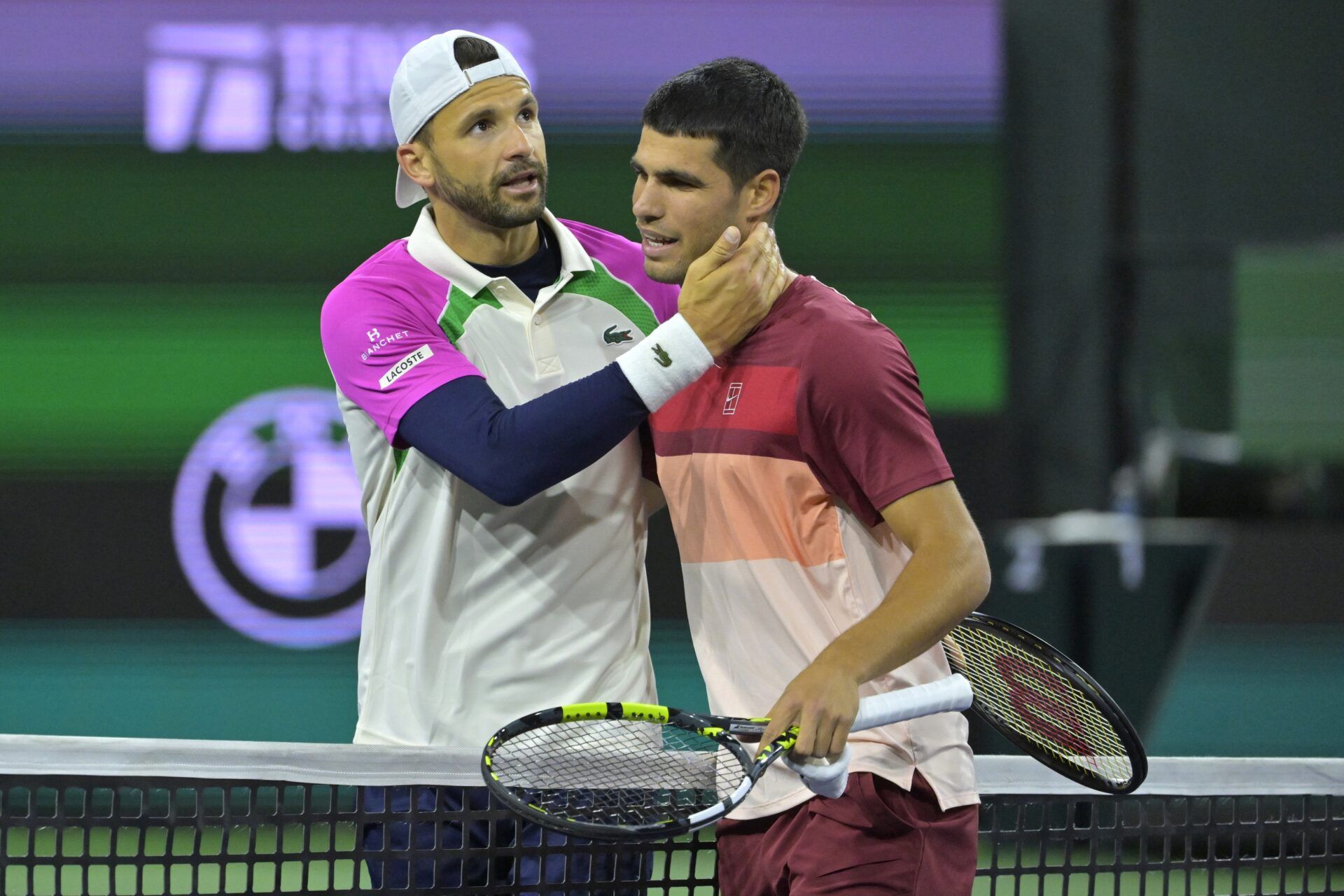 Grigor Dimitrov (BUL) congratulates Carlos Alcaraz (ESP) following their the fourth round of the BNP Paribas Open at the Indian Well Tennis Garden.