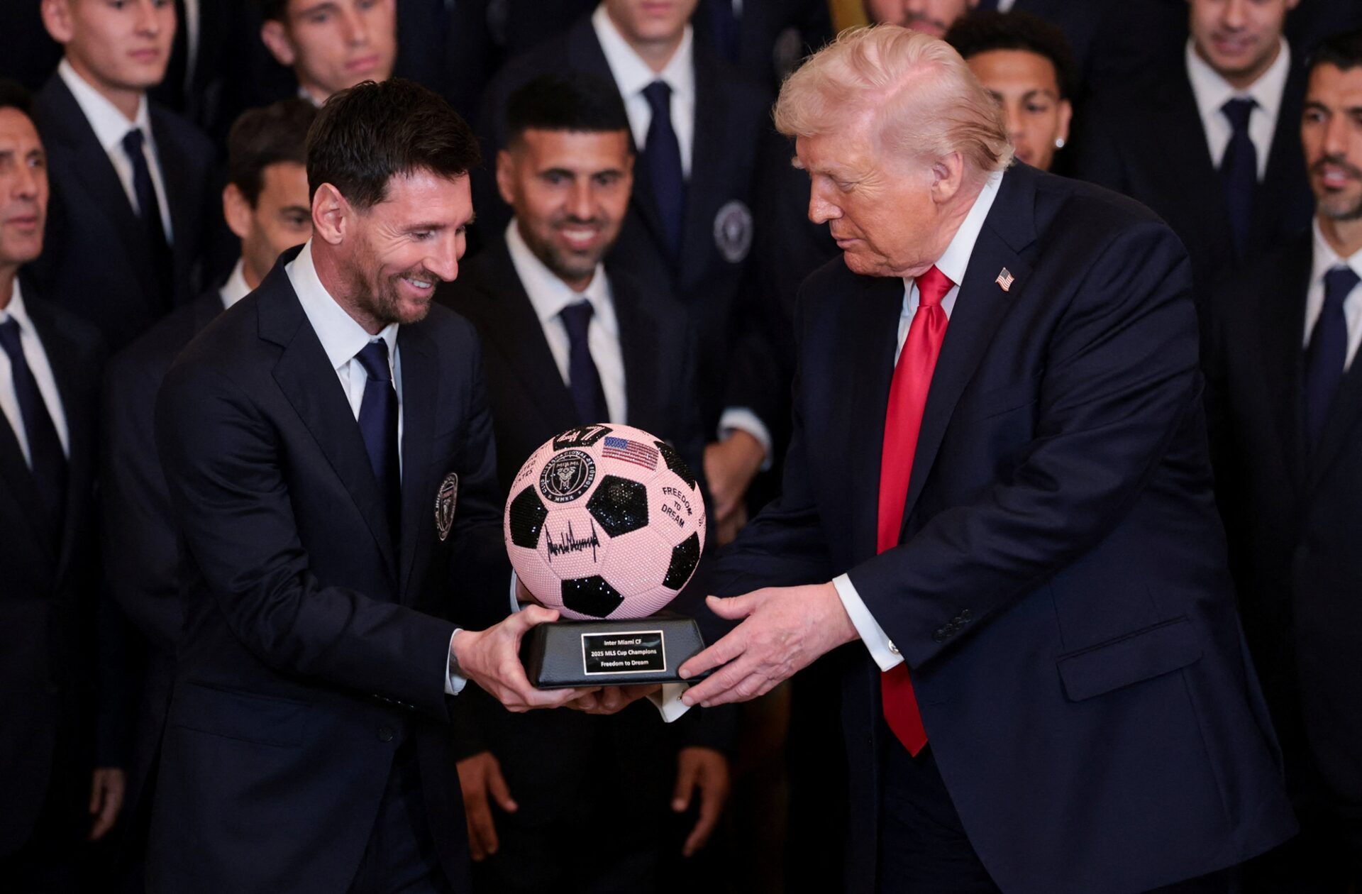[US, Mexico, & Canada customers only] Mar 5, 2026; Washington, DC, UNITED STATES;  U.S. President Donald Trump is gifted a jewelled soccer ball with his signature on it from Inter Miami CF captain Lionel Messi, on the day he honors reigning Major League Soccer (MLS) champion Inter Miami CF players and team officials with an event in the East Room of the White House.