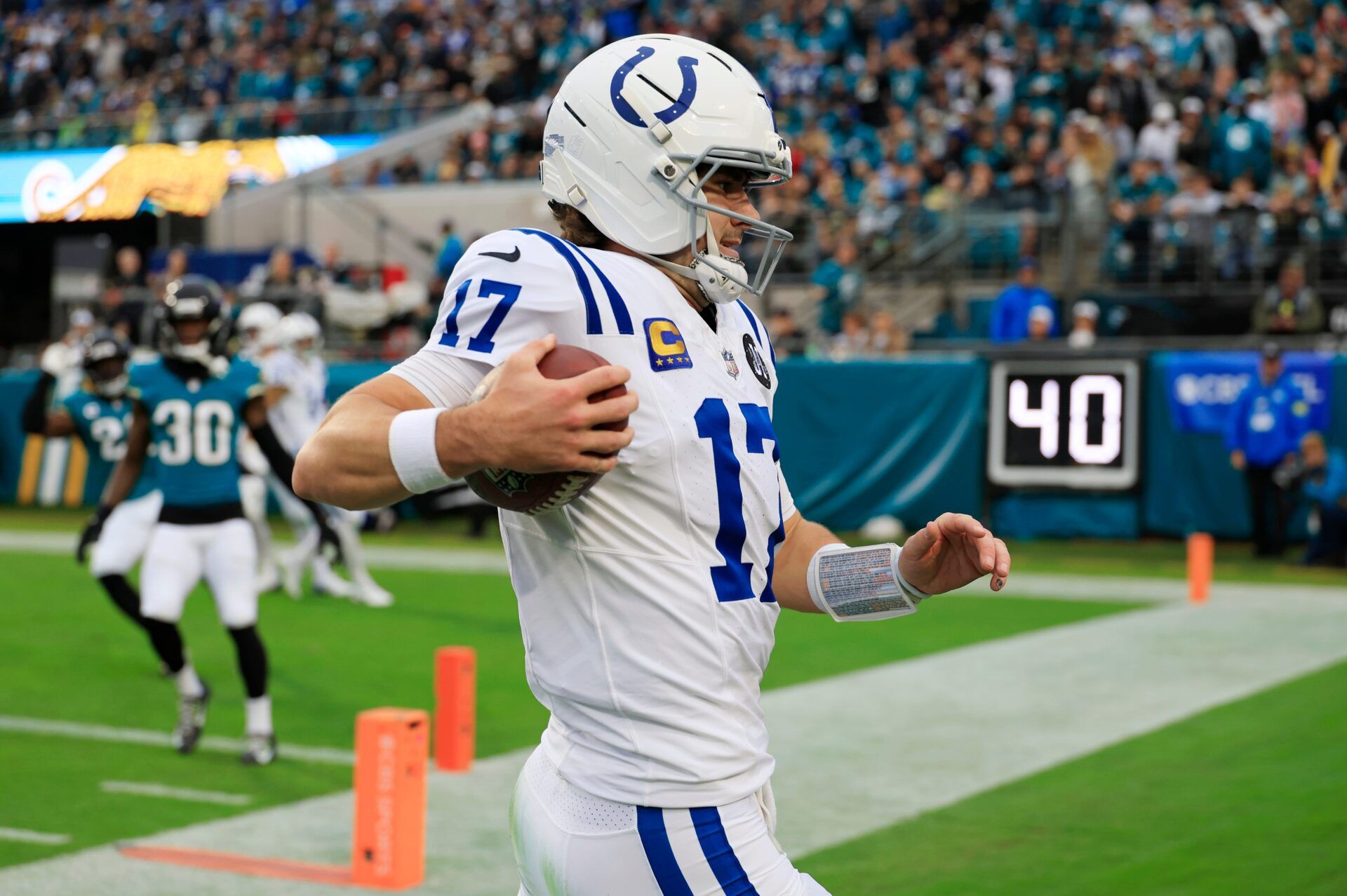 Indianapolis Colts quarterback Daniel Jones (17) is forced out of bounds on a keeper during the first quarter of an NFL football game at EverBank Stadium, Sunday, Dec. 7, 2025, in Jacksonville, Fla. The Jaguars defeated the Colts 36-19.