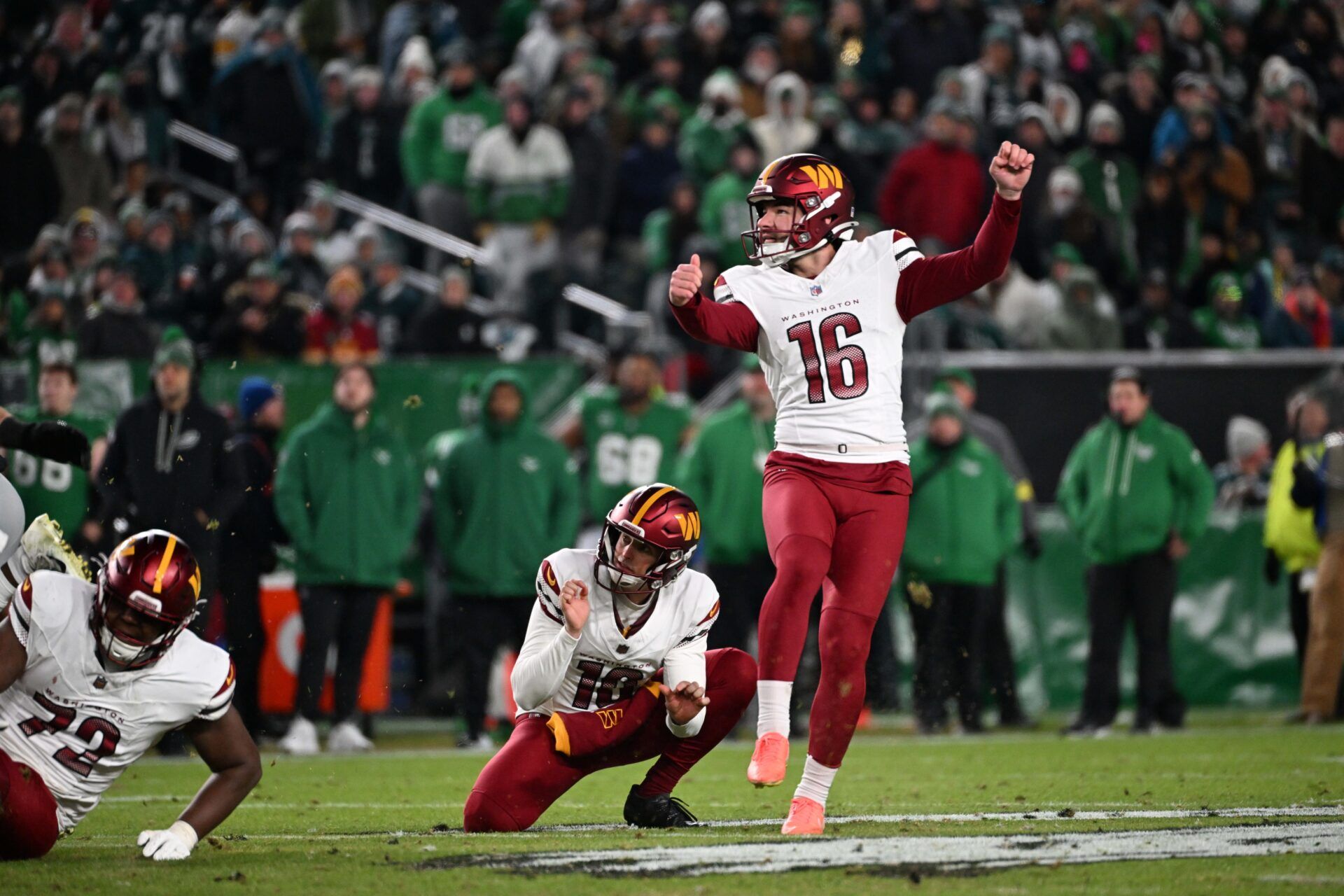 Washington Commanders place kicker Jake Moody (16) watches his 56-yard field goal during the second quarter against the Philadelphia Eagles at Lincoln Financial Field.