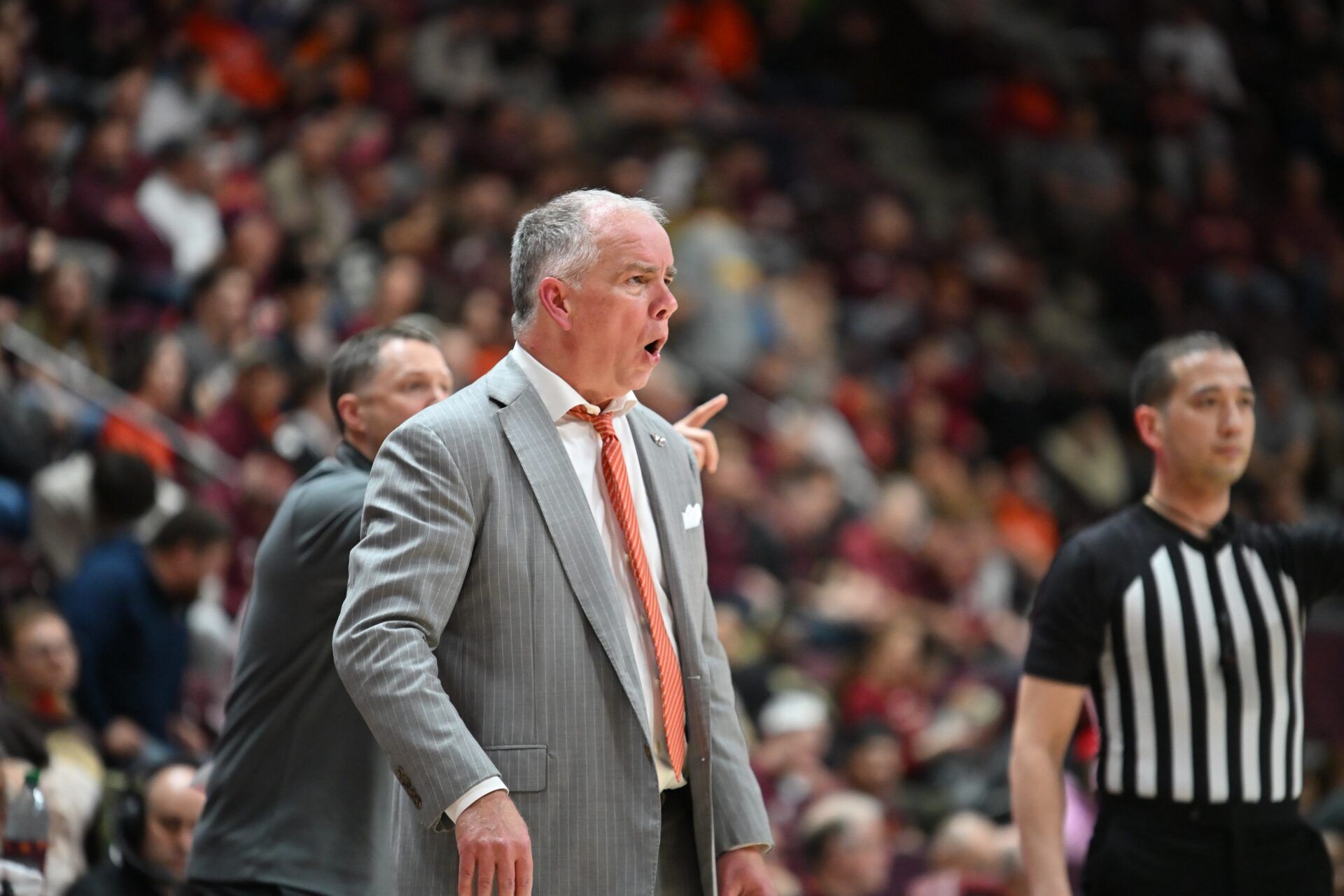 Virginia Tech Hokies head coach Mike Young gives instructions to his team during the first half at Cassell Coliseum.
