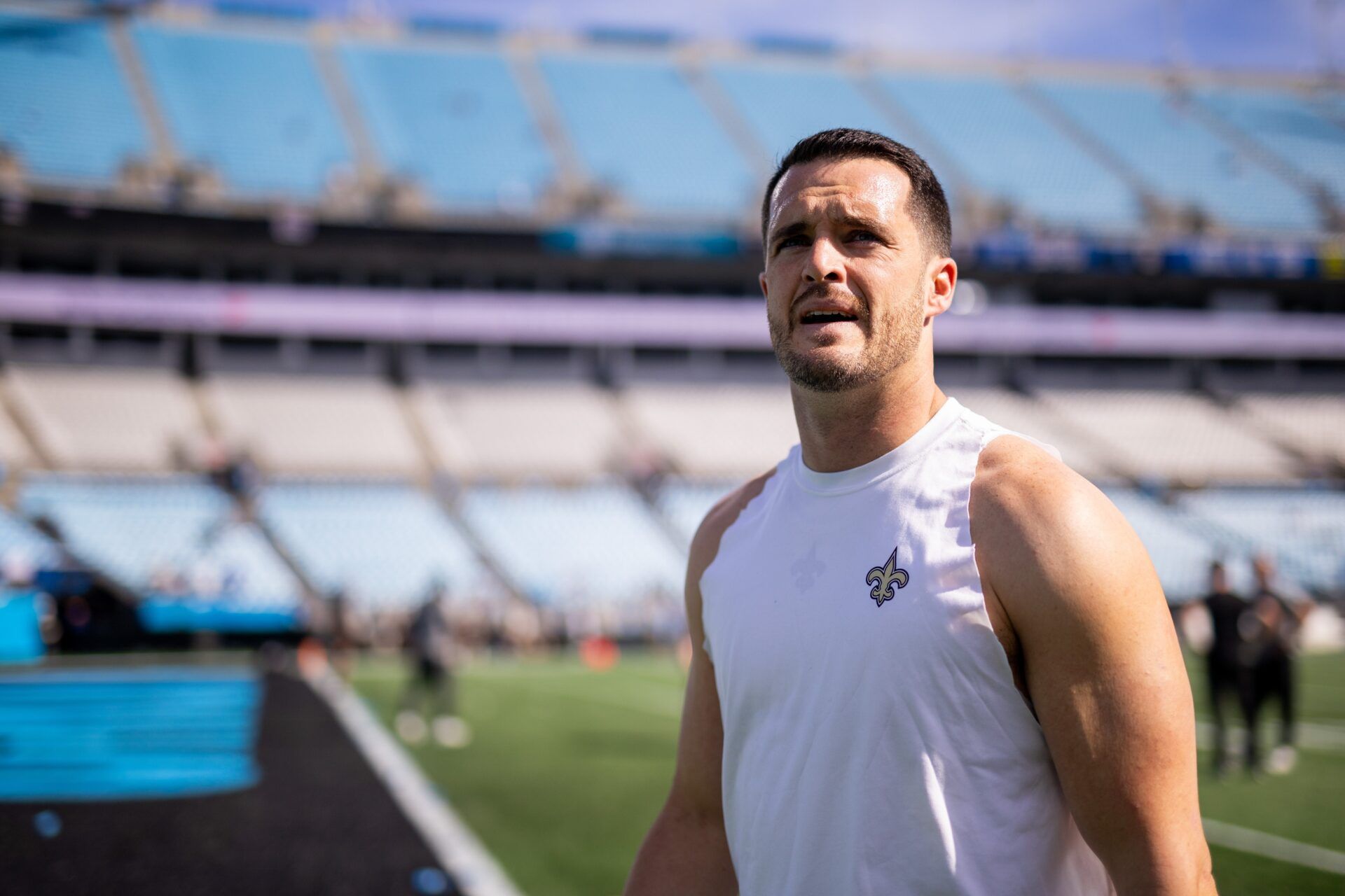 New Orleans Saints quarterback Derek Carr (4) walks off before a game against the Carolina Panthers at Bank of America Stadium.