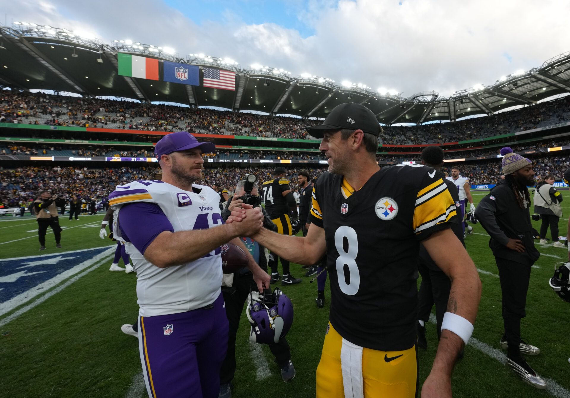 Minnesota Vikings long snapper Andrew Depaola (42) and Pittsburgh Steelers quarterback Aaron Rodgers (8) shake hands following a game during an NFL International Series game at Croke Park.