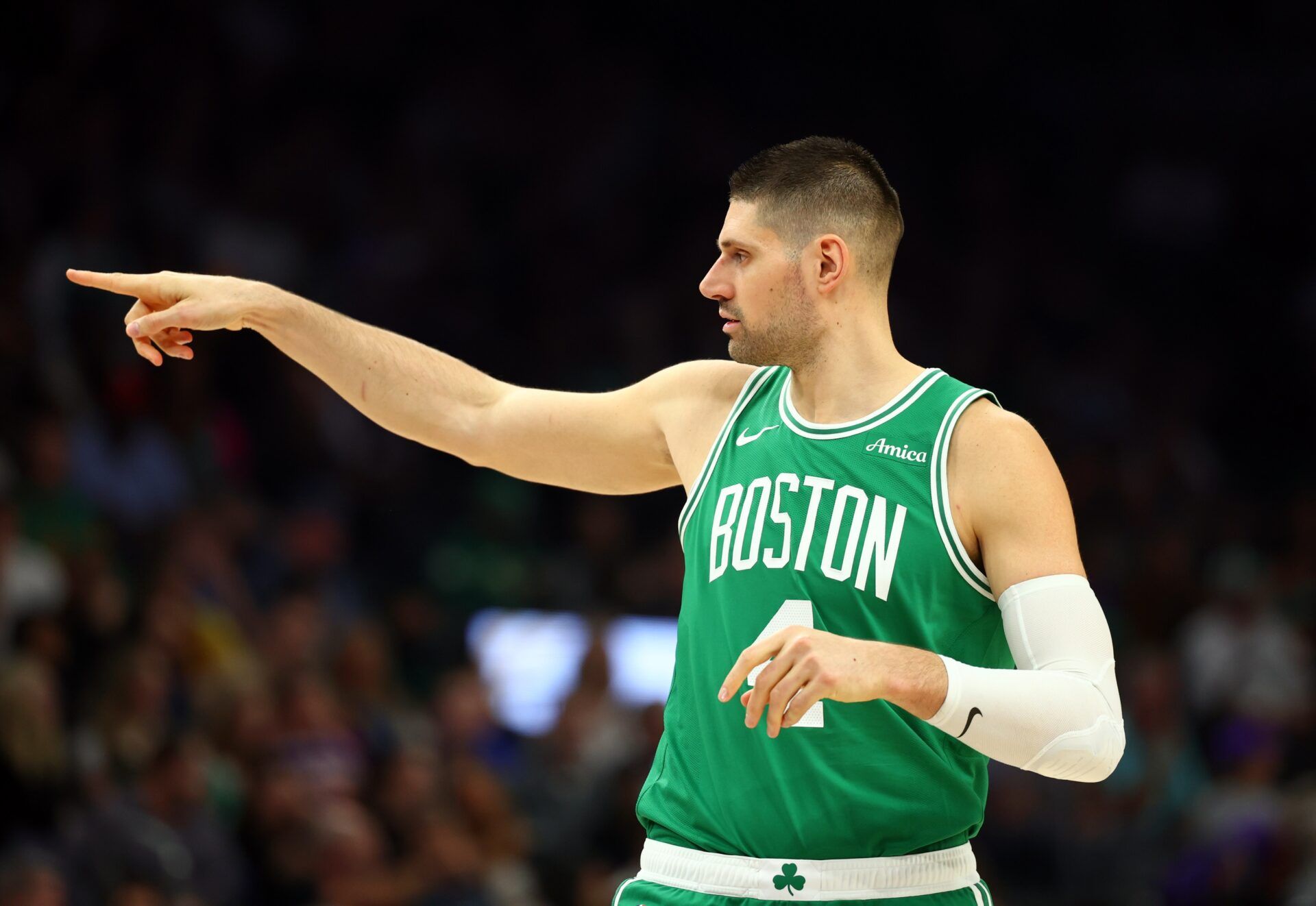 Boston Celtics center Nikola Vucevic (4) reacts against the Phoenix Suns in the first half at Mortgage Matchup Center.