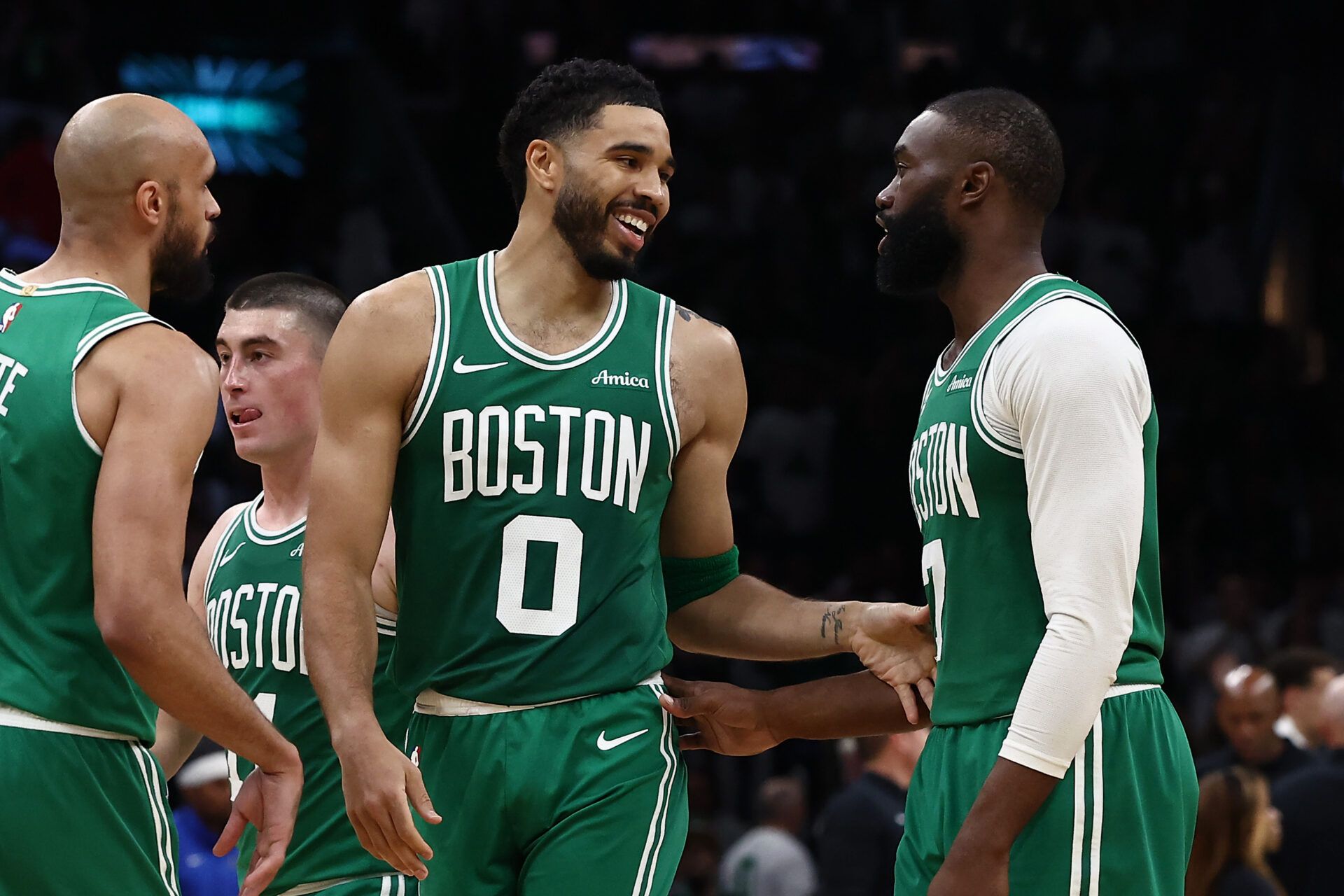 Boston Celtics forward Jayson Tatum (0) has a laugh with guard Jaylen Brown (7) during the second half against the Dallas Mavericks at TD Garden.