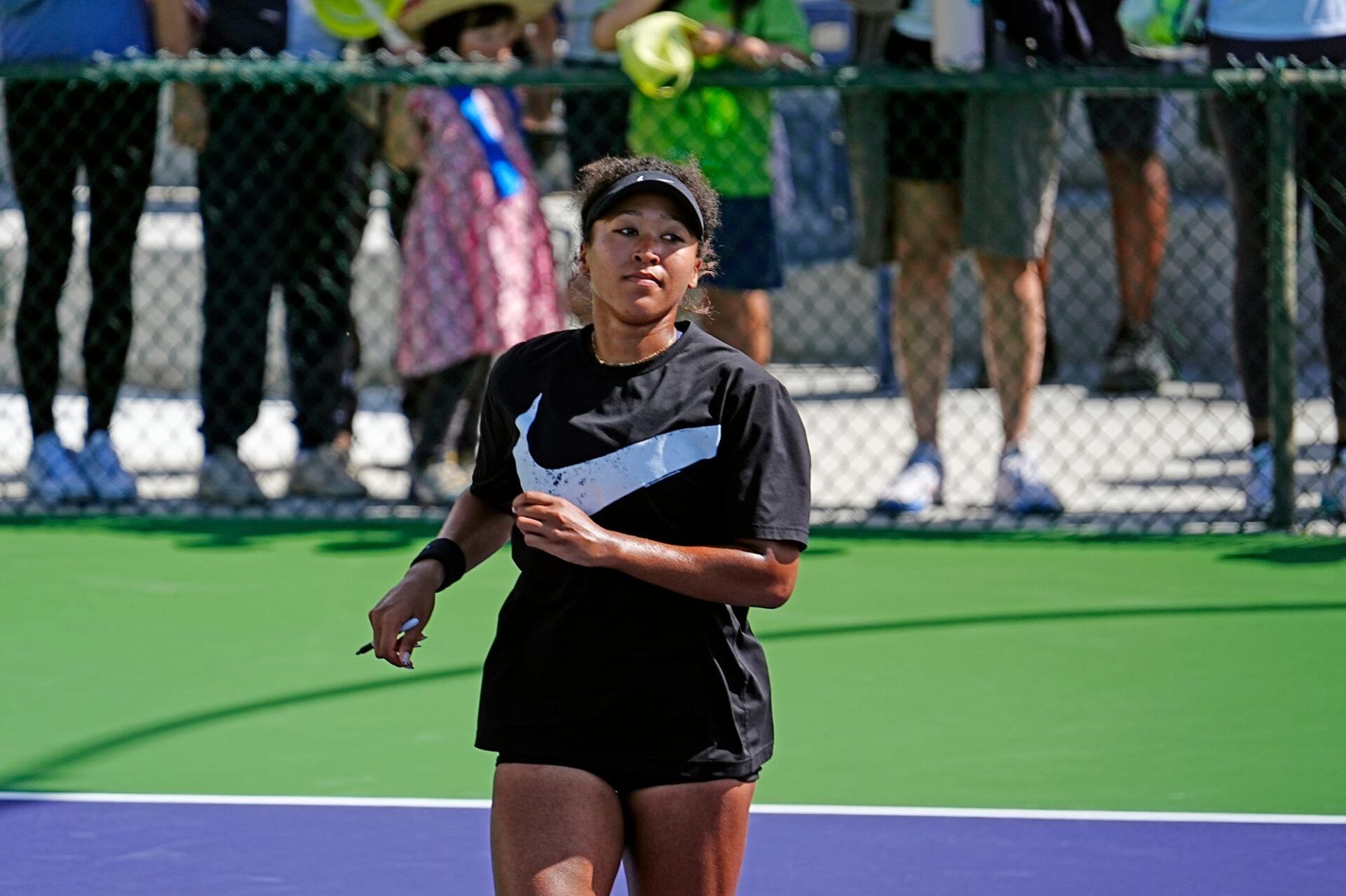 Naomi Osaka jogs off the practice court after signing her autograph for fans during the BNP Paribas Open in Indian Wells, Calif., on Monday, March 2, 2026.
