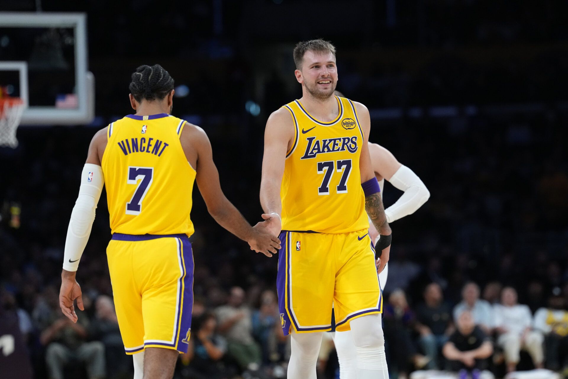 Los Angeles Lakers guard Luka Doncic (77) celebrates with guard Gabe Vincent (7) in the second half against the Minnesota Timberwolves at Crypto.com Arena.