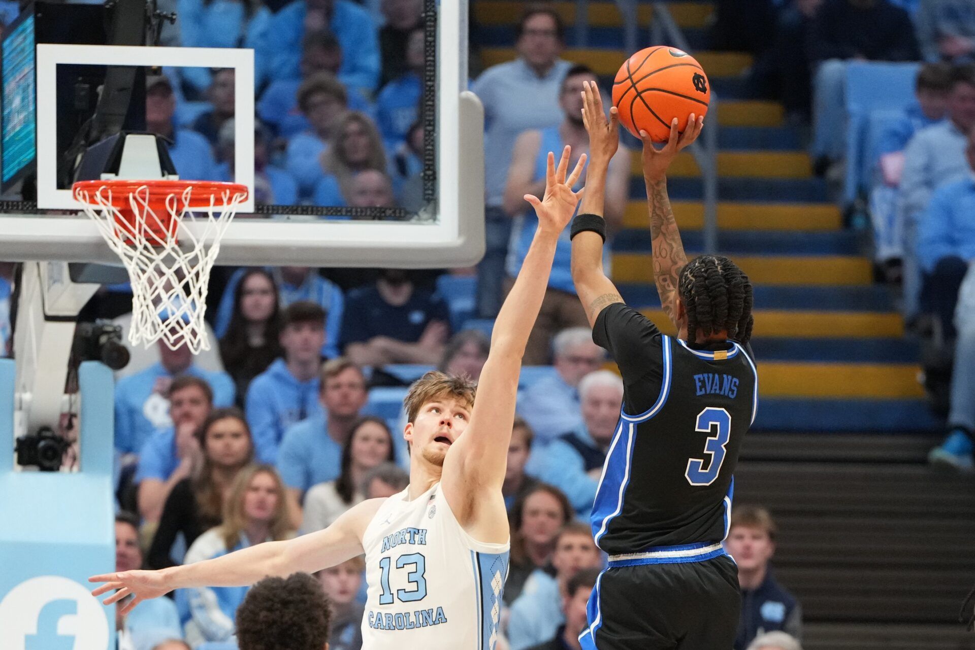 Duke Blue Devils guard Isaiah Evans (3) shoots as North Carolina Tar Heels center Henri Veesaar (13) defends in the second half at Dean E. Smith Center.