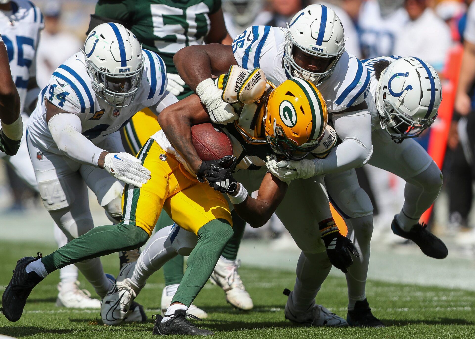 Green Bay Packers wide receiver Bo Melton (80) is tackled by Indianapolis Colts linebacker Zaire Franklin (44), cornerback Chris Lammons (35) and cornerback Kenny Moore II (23) on Sunday, September 15, 2024, at Lambeau Field in Green Bay, Wis. The Packers won the game, 16-10.
Tork Mason/USA TODAY NETWORK-Wisconsin