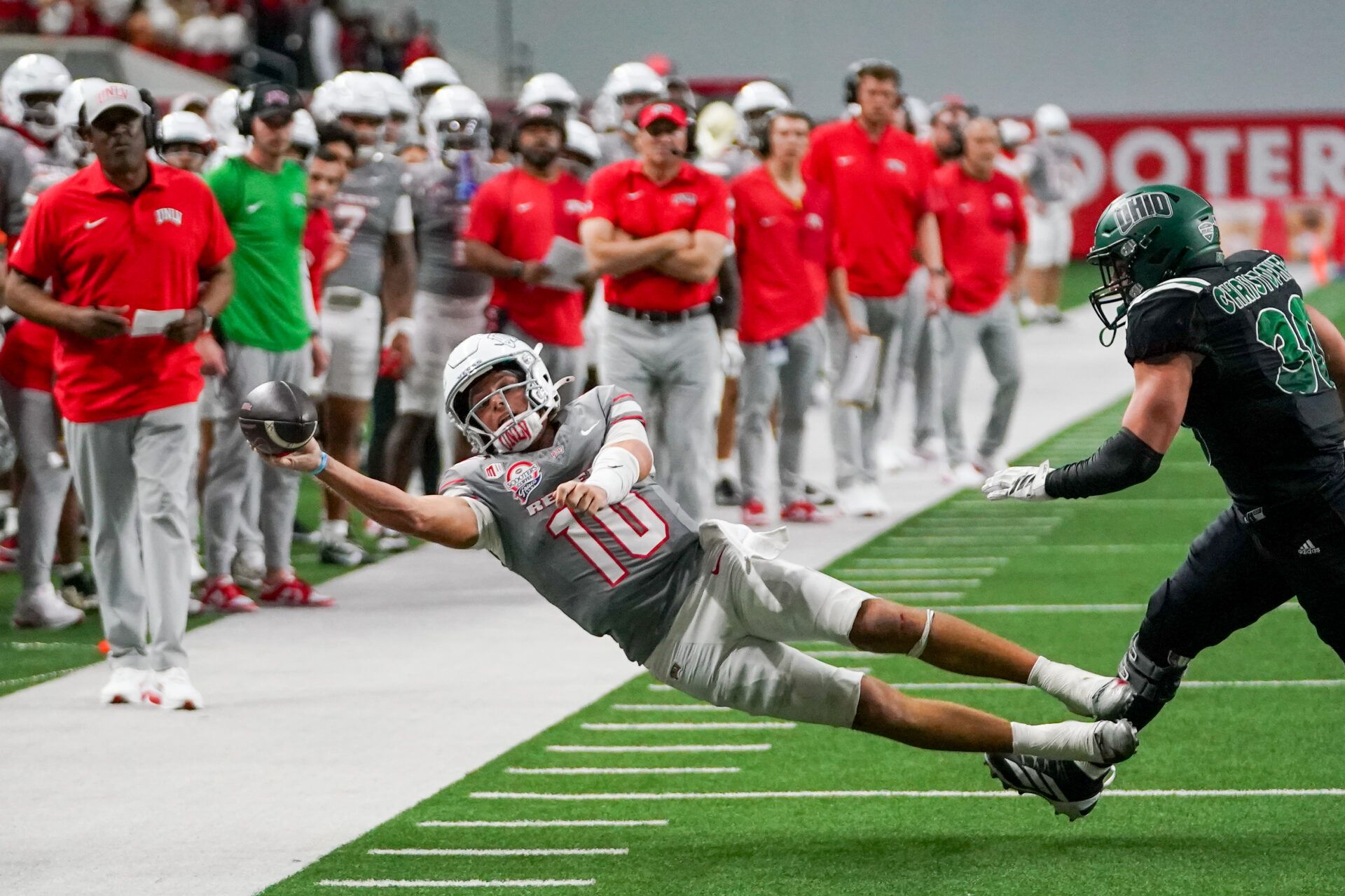 UNLV Rebels quarterback Anthony Colandrea (10) attempts a pass as he is chased by Ohio Bobcats linebacker Charlie Christopher (30) during the second half at the Ford Center at The Star.
