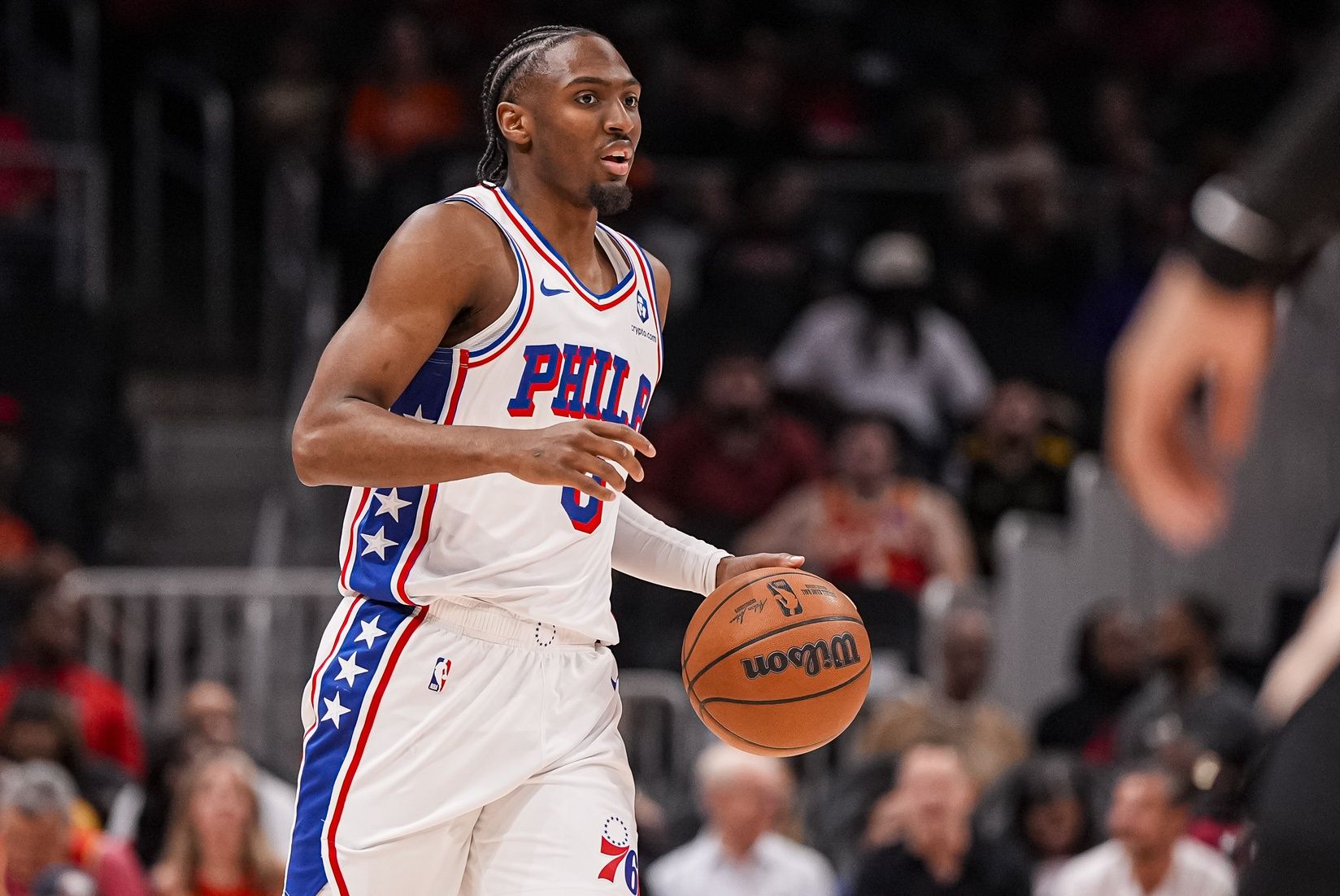 Philadelphia 76ers guard Tyrese Maxey (0) brings the ball up the court against the Atlanta Hawks during the first half at State Farm Arena.