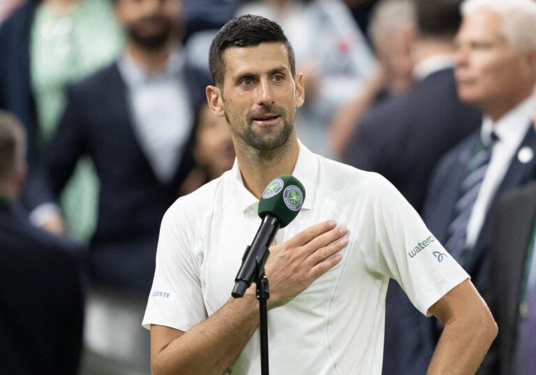 Novak Djokovic of Serbia at his on court interview after winning his match against Holger Rune of Denmark (not shown) on day eight of The Championships at All England Lawn Tennis and Croquet Club.