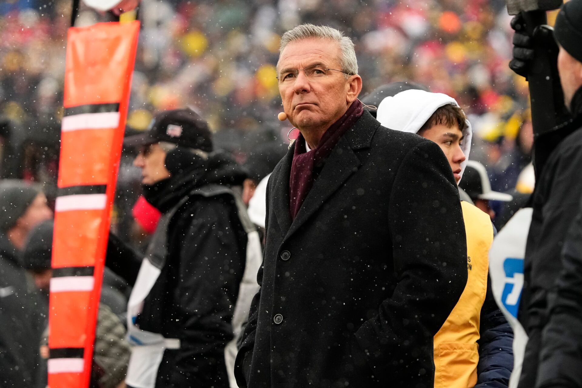 Former head coach Urban Meyer watches from the sideline during the NCAA football game between the Michigan Wolverines and the Ohio State Buckeyes at Michigan Stadium in Ann Arbor, Mich. on Nov. 29, 2025. Ohio State won 27-9.