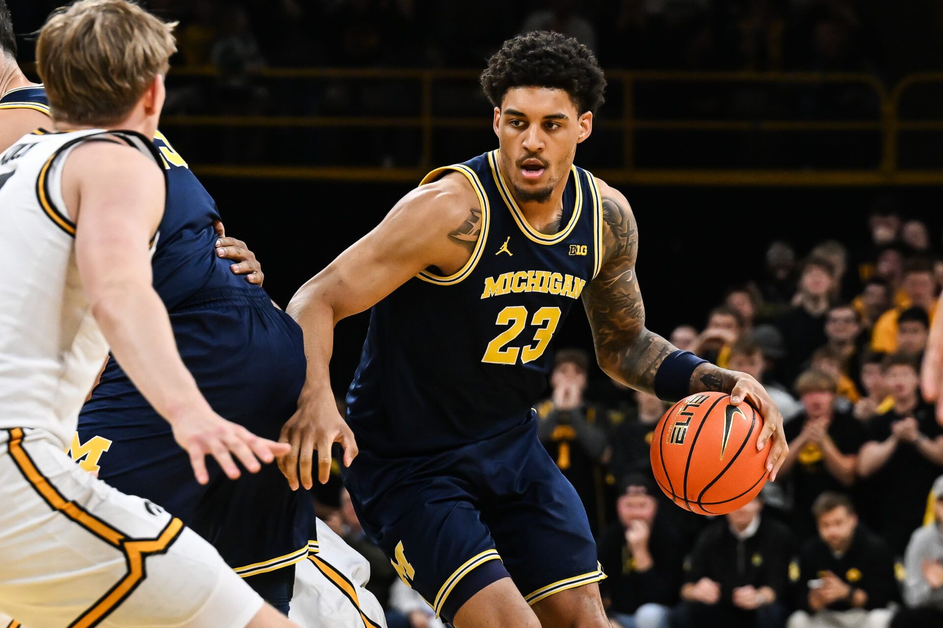 Michigan Wolverines forward Yaxel Lendeborg (23) controls the ball against the Iowa Hawkeyes during the first half at Carver-Hawkeye Arena.