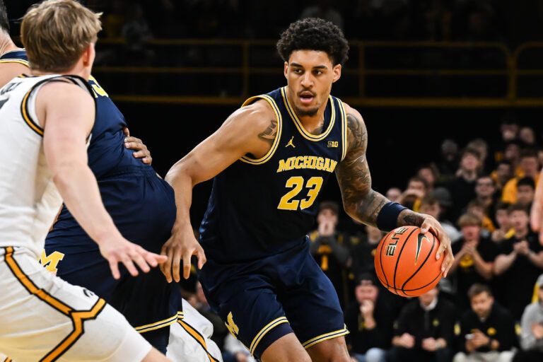 Michigan Wolverines forward Yaxel Lendeborg (23) controls the ball against the Iowa Hawkeyes during the first half at Carver-Hawkeye Arena.
