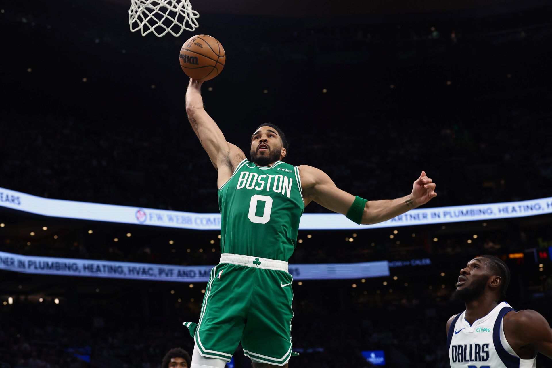 Boston Celtics forward Jayson Tatum (0) goes to the basket during the second quarter against the Dallas Mavericks at TD Garden.