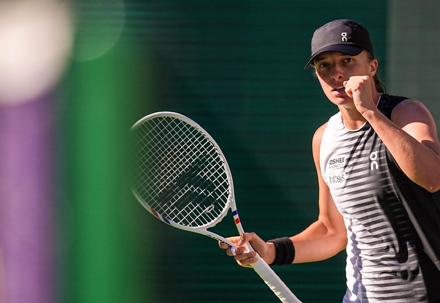 Iga Światek celebrates a point over Kayla Day during their second-round match at the BNP Paribas Open in Indian Wells, Calif., Saturday, March 7, 2026.