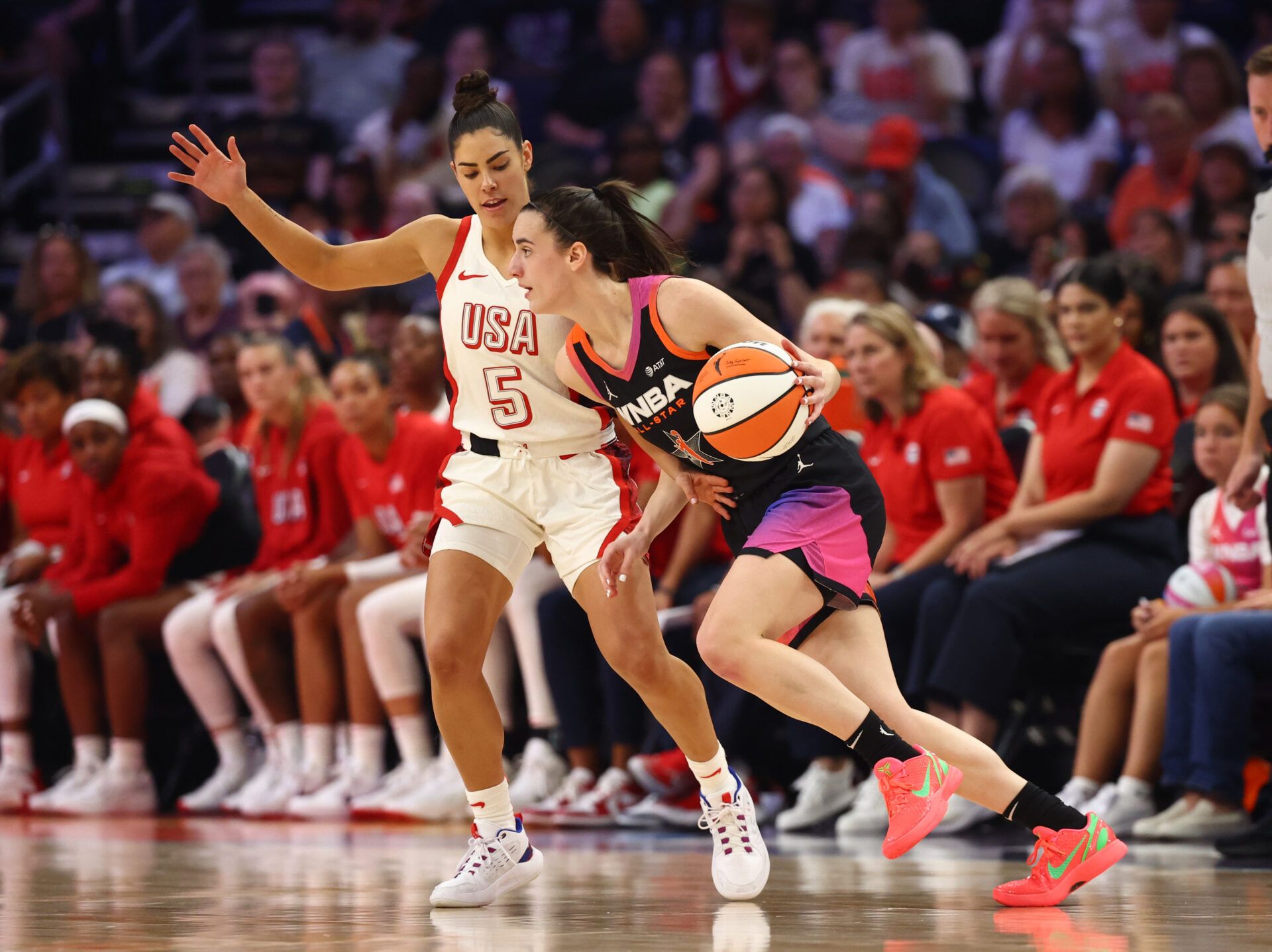Team WNBA guard Caitlin Clark (22) against USA Women's National Team player Kelsey Plum (5) at Footprint Center.