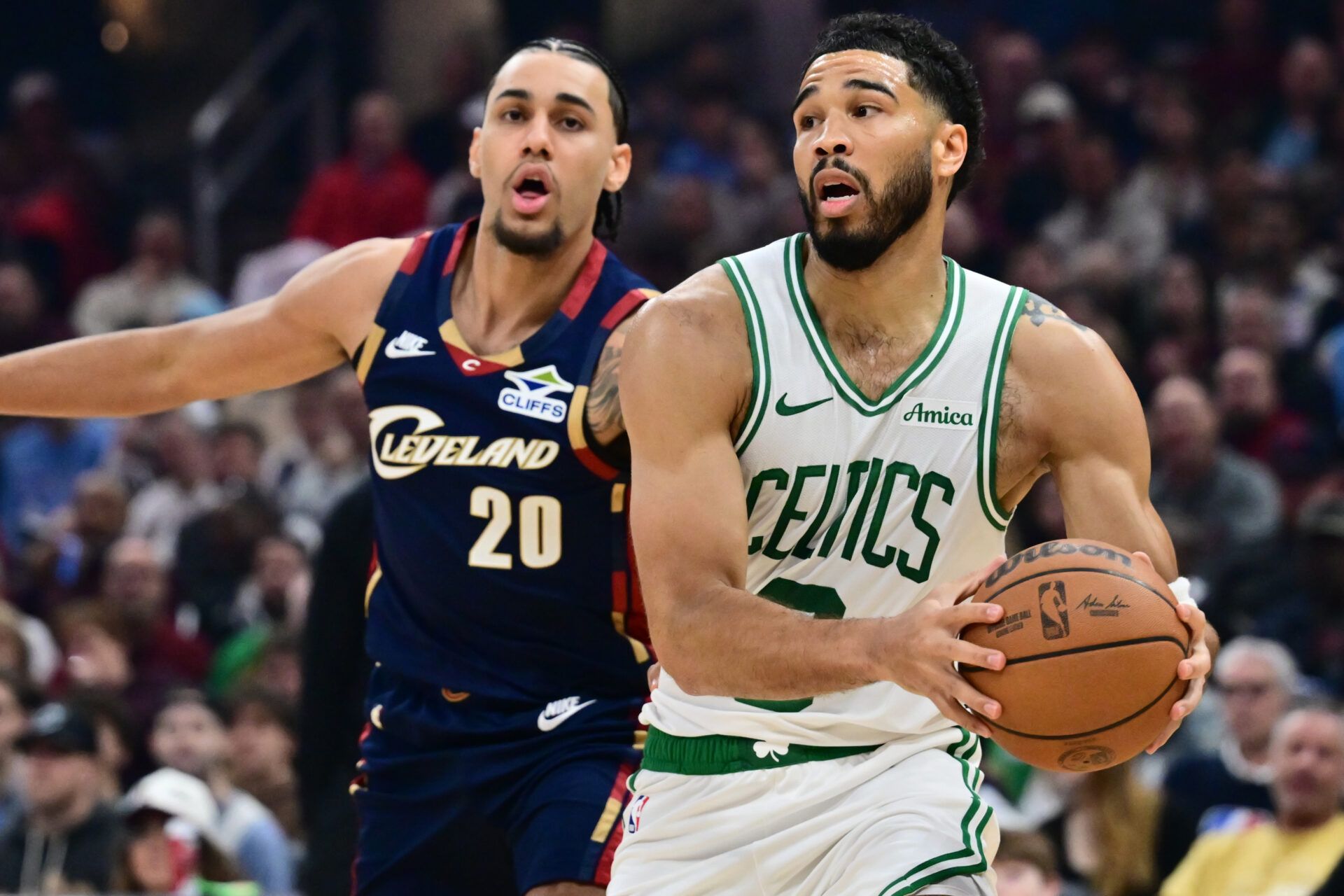 Boston Celtics forward Jayson Tatum (0) drives to the basket against Cleveland Cavaliers guard Jaylon Tyson (20) during the first half at Rocket Arena.