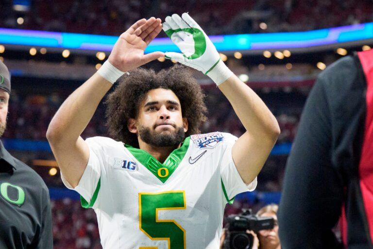 Oregon quarterback Dante Moore walks off the field as the Oregon Ducks face the Indiana Hoosiers in the Peach Bowl on Jan. 9, 2026, at Mercedes-Benz Stadium in Atlanta, Georgia.