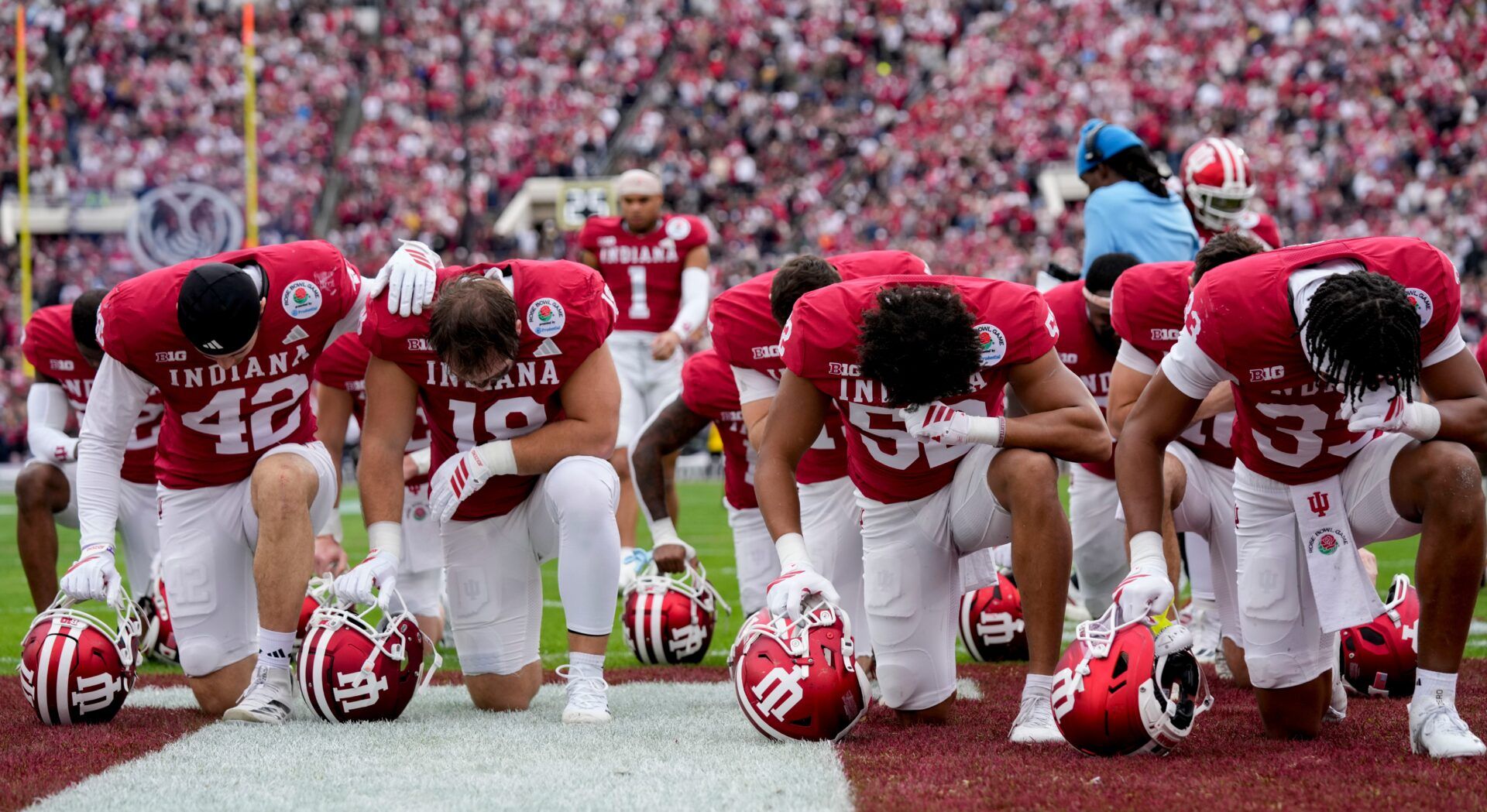 Indiana Hoosiers players pray Thursday, Jan. 1, 2026, before the Rose Bowl and quarterfinal game of the College Football Playoff against Alabama Crimson Tide at Rose Bowl Stadium in Pasadena, Calif.