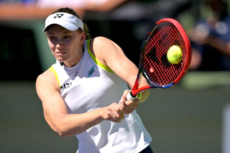 Elena Rybakina (KAZ) hits a shot during her second round match against Hailey Baptiste (USA) in the BNP Paribas Open at the Indian Wells Tennis Garden.