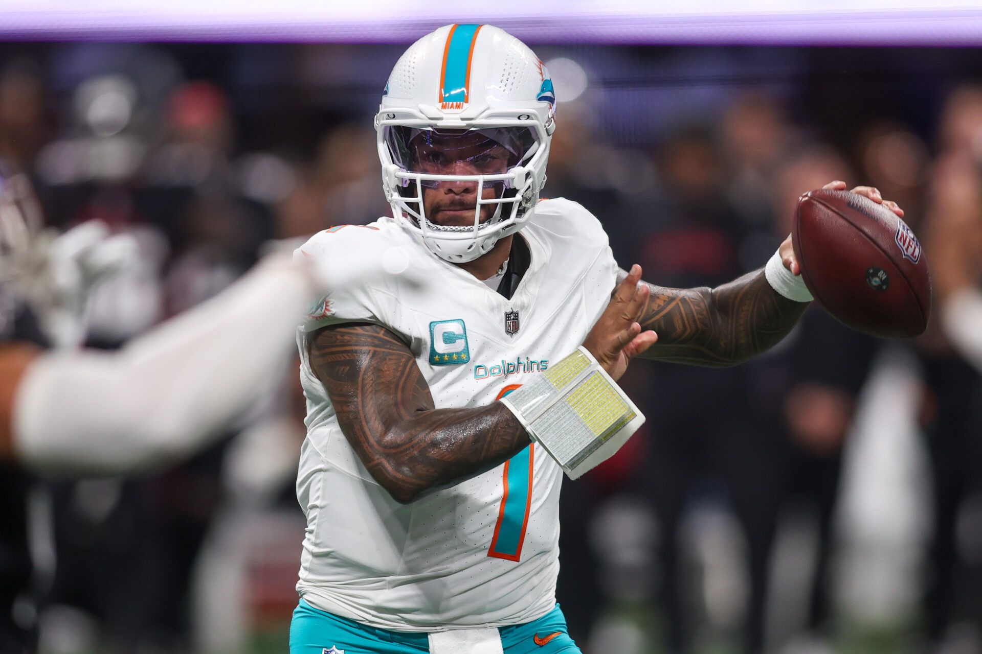 Miami Dolphins quarterback Tua Tagovailoa (1) throws a pass against the Atlanta Falcons in the fourth quarter at Mercedes-Benz Stadium.