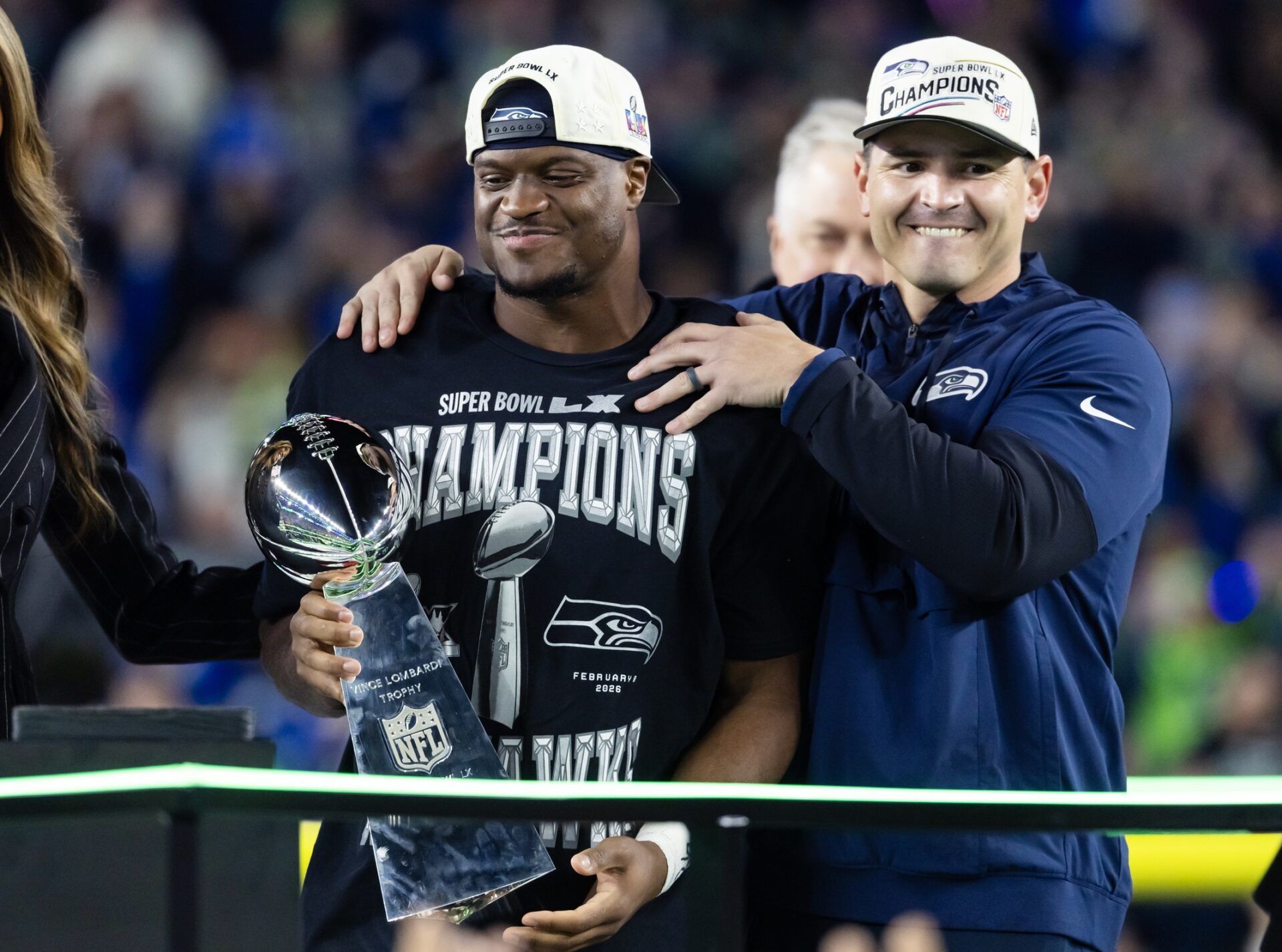 Seattle Seahawks head coach Mike MacDonald and running back Kenneth Walker III (9) celebrate with the Vince Lombardi trophy after defeating the New England Patriots in Super Bowl LX at Levi's Stadium.