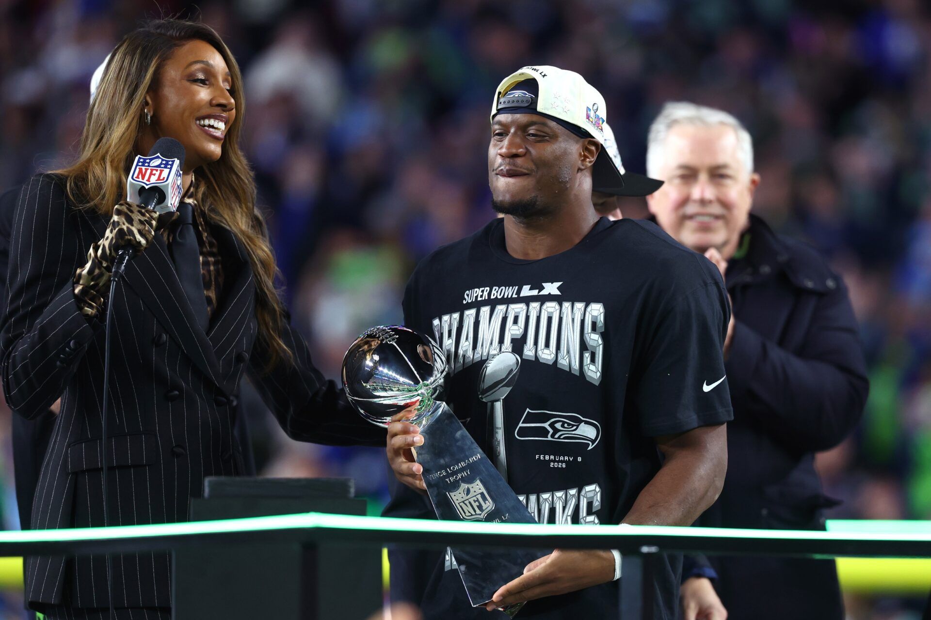 Seattle Seahawks running back Kenneth Walker III (9) celebrates with the Vince Lombardi trophy after defeating the New England Patriots in Super Bowl LX at Levi's Stadium.