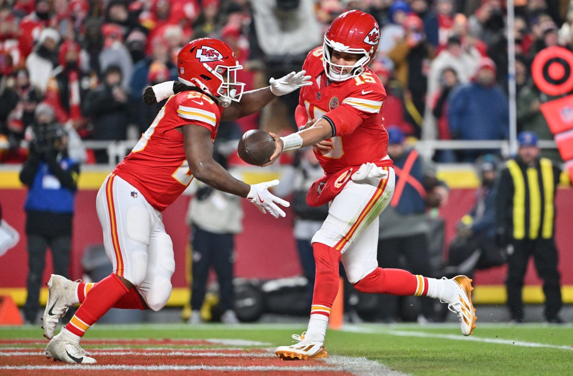Kansas City Chiefs quarterback Patrick Mahomes (15) hands the ball off to Kansas City Chiefs running back Kareem Hunt (29) during the second quarter against the Houston Texans at GEHA Field at Arrowhead Stadium.