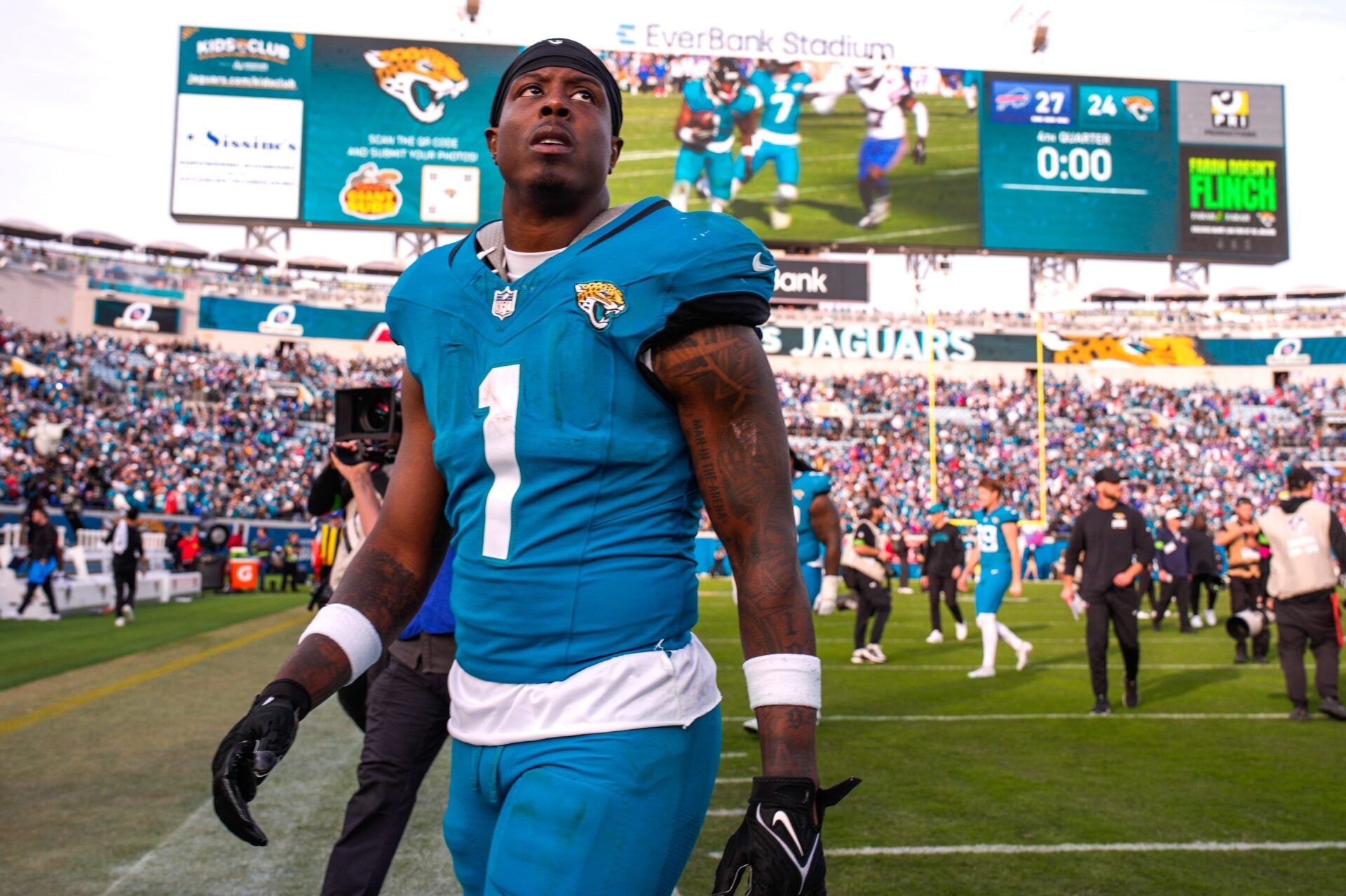 Jacksonville Jaguars running back Travis Etienne Jr. (1) walks off the field after losing to the Bills during an NFL football AFC Wild Card playoff matchup, Sunday, Jan. 11, 2026, in Jacksonville, Fla. Bills lead 10-7 at the half over the Jaguars. The Bills defeated the Jaguars 27-24. [Doug Engle/Florida Times-Union]
