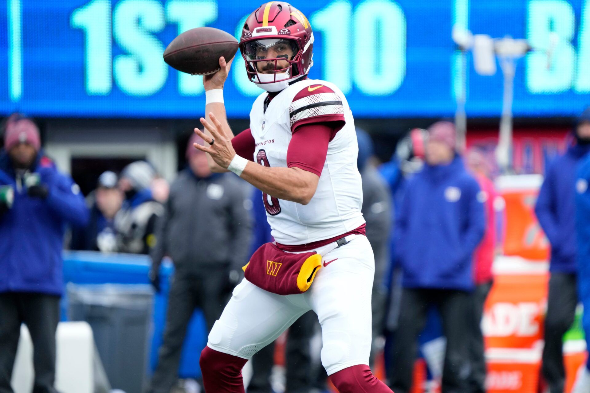 Washington Commanders quarterback Marcus Mariota (8) looks for an open teammate, Sunday, December 14, 2025, in East Rutherford.