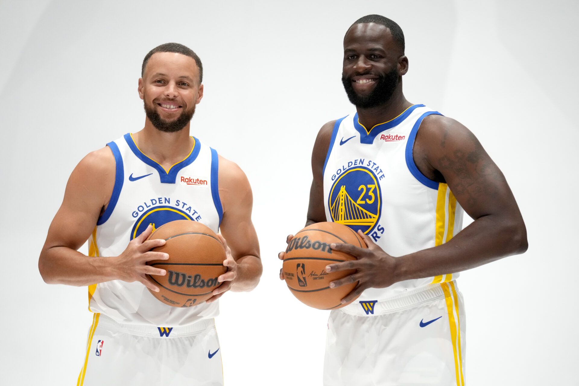 Golden State Warriors guard Stephen Curry (30) and forward Draymond Green (23) pose for a photo during Media Day at the Chase Center.