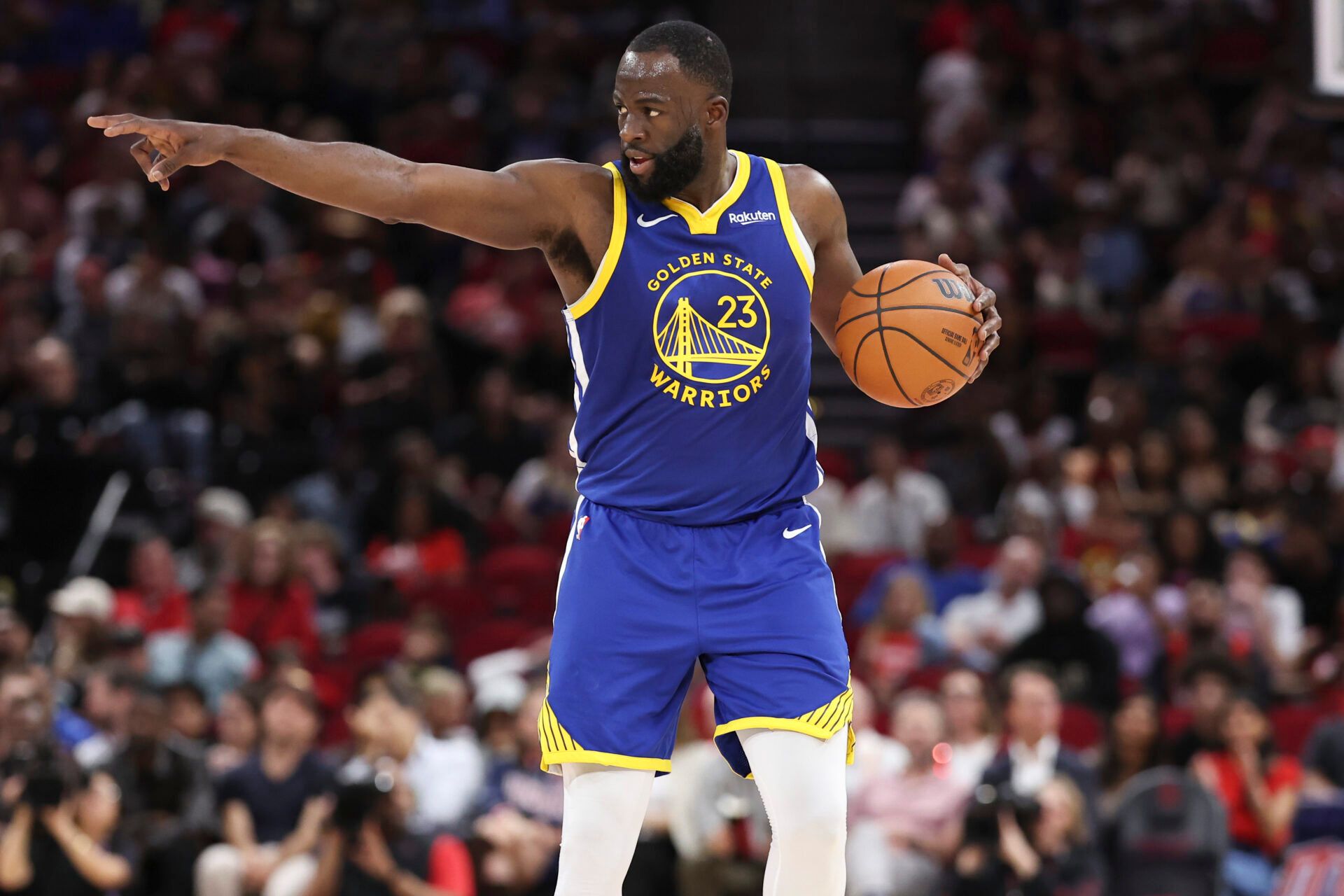 Golden State Warriors forward Draymond Green (23) brings the ball up the court during the second quarter against the Houston Rockets at Toyota Center.