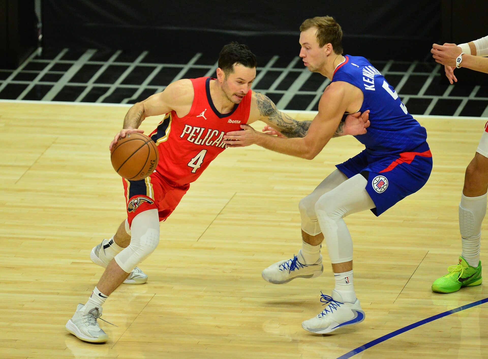 New Orleans Pelicans guard JJ Redick (4) moves the ball against Los Angeles Clippers guard Luke Kennard (5) during the first half at Staples Center.