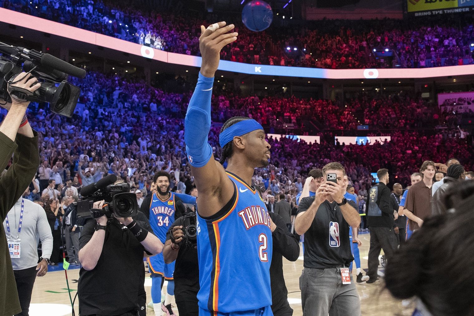 Oklahoma City Thunder guard Shai Gilgeous-Alexander (2) gestures and walks around the court after sinking a game winner 3 pointer basket against the Denver Nuggets during the second half at Paycom Center.